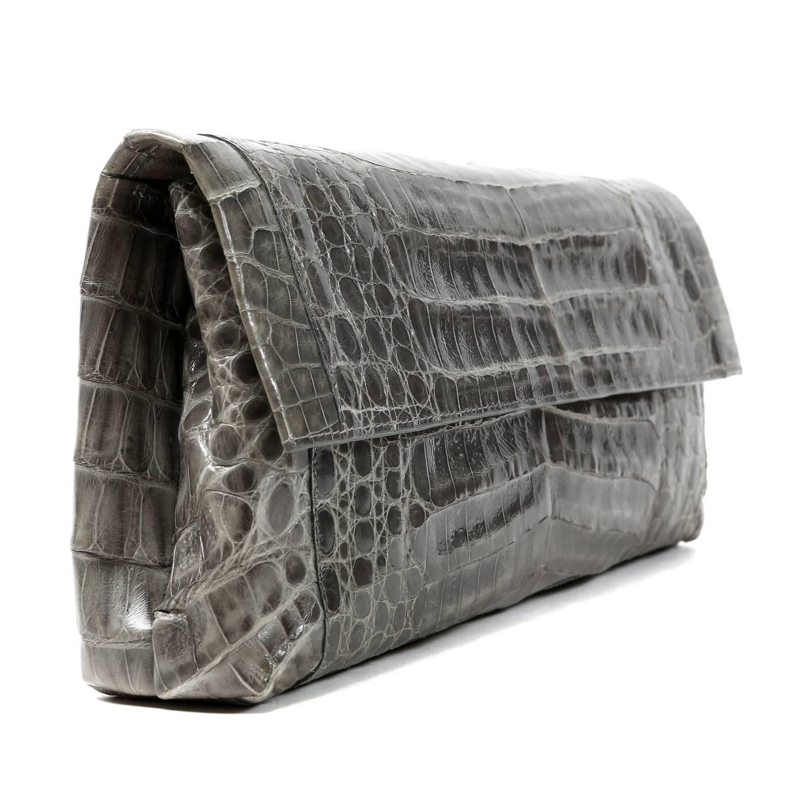 Nancy Gonzalez Grey Crocodile-Oversized Clutch- NEW
Made from the finest skins, Nancy Gonzalez bags are highly collectible classics that always hold their value.
 
Exotic grey glossy crocodile clutch is the perfect piece for any sophisticated