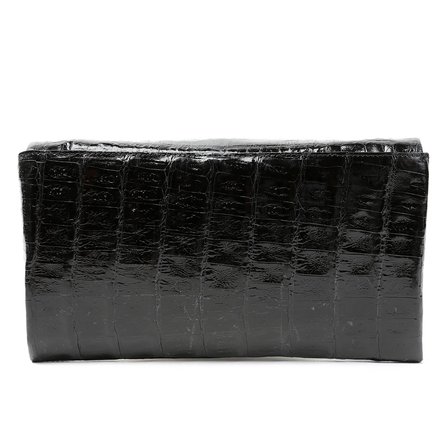 Nancy Gonzalez Black Crocodile Clutch- NEW
. Made from the finest skins, Nancy Gonzalez bags are highly collectible classics that always hold their value.
 
Sleek black glossy crocodile clutch is the perfect piece for any sophisticated wardrobe. 