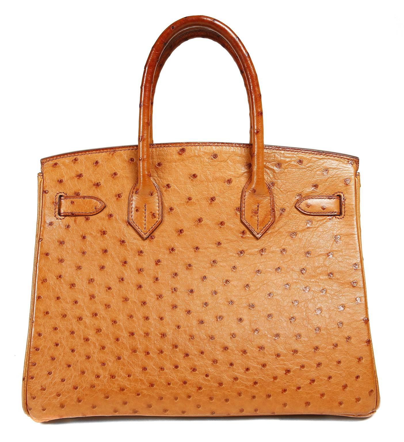 Hermès Saffron Ostrich 30 cm Birkin Bag- PRISTINE 
 Hermès bags are considered the ultimate luxury item the world over.  Hand stitched by skilled craftsmen, wait lists of a year or more are commonplace.  This particular Birkin is in exotic