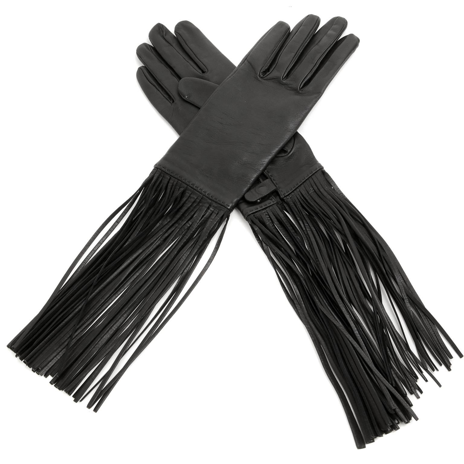 Hermès Black Lambskin Fringed Gloves- PRISTINE
Extraordinarily chic, these gloves are certain to enhance jackets, coats and sweaters with major wow factor. 
 
Beautifully soft black lambskin gloves have extra-long leather fringe surrounding the