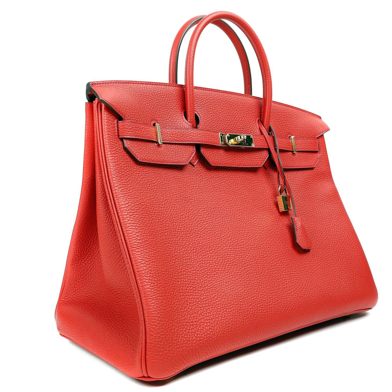Hermès 40 cm Rouge Tomate Togo Birkin Bag- PRISTINE; Plastic on hardware 
New red for 2015-2016.   Vibrant “tomato red” color with gold hardware. 
Waitlists exceeding a year are commonplace for the intensely coveted Birkin bag.  Each piece is