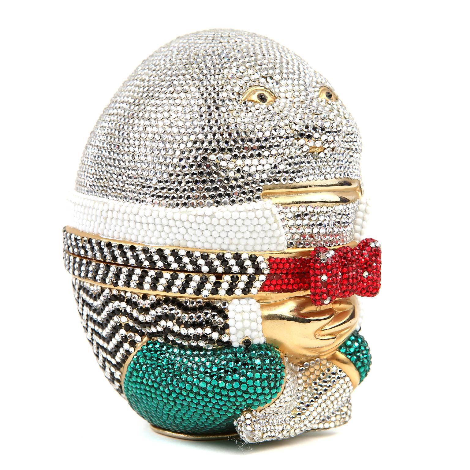 Judith Leiber Humpty Dumpty Minaudiere- Mint Condition; Collectible

Green, black, white and red crystals adorn a regal Humpty Dumpty.  Gold hardware and hinged top.  Gold tasseled comb included.
