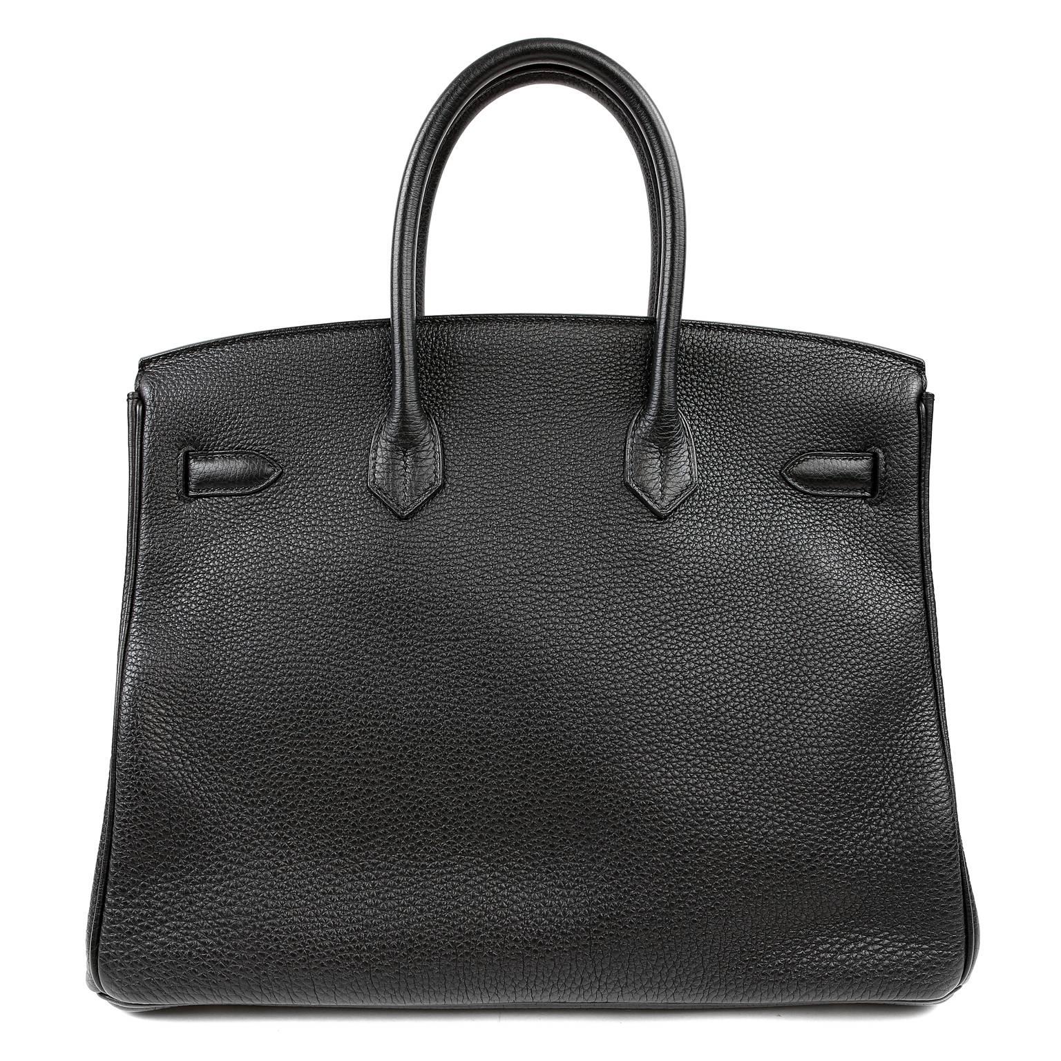Hermès Black 35 cm  Togo Birkin Bag is in mint condition. 
Long waitlists are commonplace for the intensely coveted Birkin.  Each piece is hand crafted by skilled artisans and represents the epitome of fashion luxury.  
 
Scratch resistant Black
