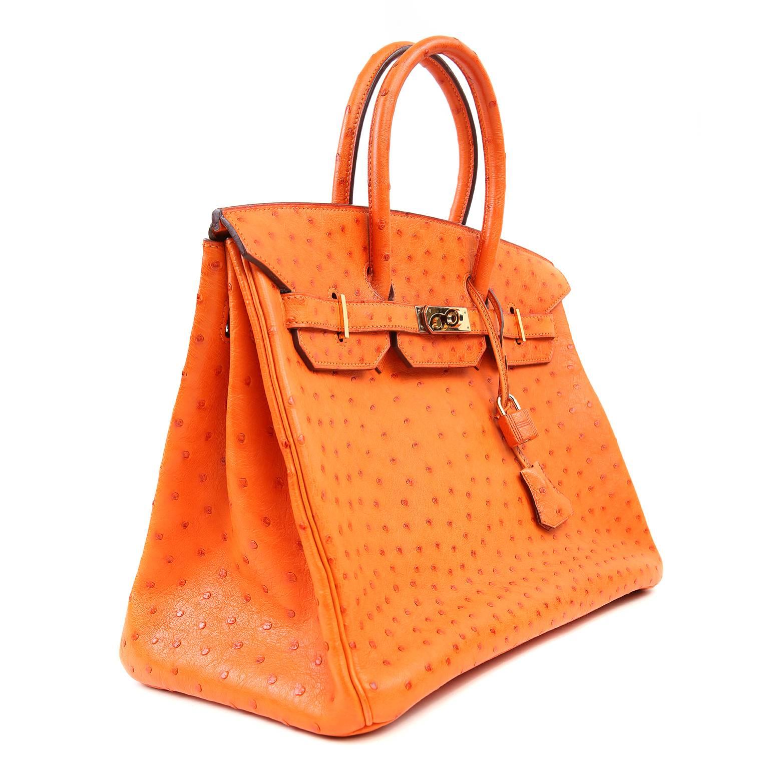 Hermès Orange Ostrich 35 cm  Birkin- Prisitne;  appears never  carried.  

  Hermès bags are considered the ultimate luxury item the world over.  Hand stitched by skilled craftsmen with extensive waitlists.  This particular Birkin is in exotic