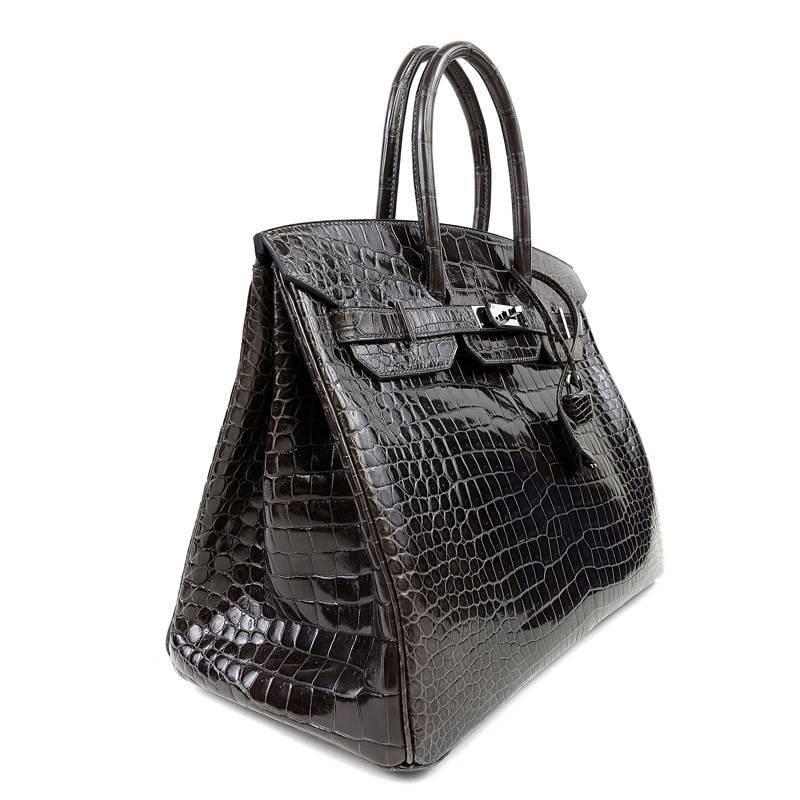 Hermès Plomb Porosus Crocodile 35 cm Birkin- Pristine
  Hermès bags are considered the ultimate luxury item the world over.  Hand stitched by skilled craftsmen, wait lists of a year or more are commonplace for the leather versions.  A Porosus