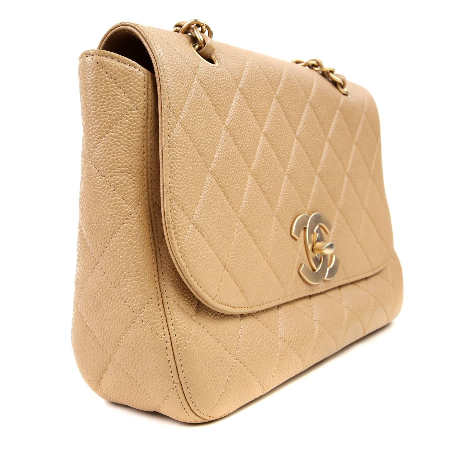 Chanel Beige Caviar Classic Flap- Excellent PLUS

  Perfectly sized for easy day to evening transitions, this timeless Chanel is a smart addition to any collection.  

Textured and durable beige caviar leather is quilted in signature Chanel