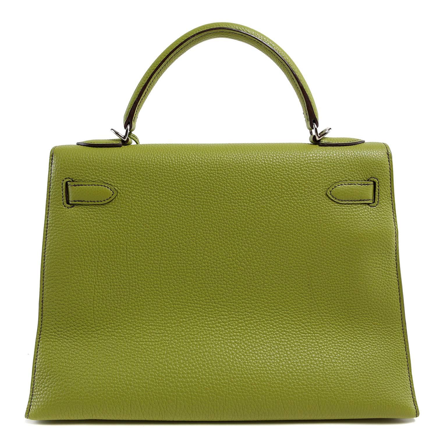 Hermès Vert Anis 32 cm Togo Kelly Bag- MINT condition
  Hermès bags are considered the ultimate luxury item worldwide.  Each piece is handcrafted with waitlists that can exceed a year or more.  Vert Anis is a dream for green lovers- vibrant and
