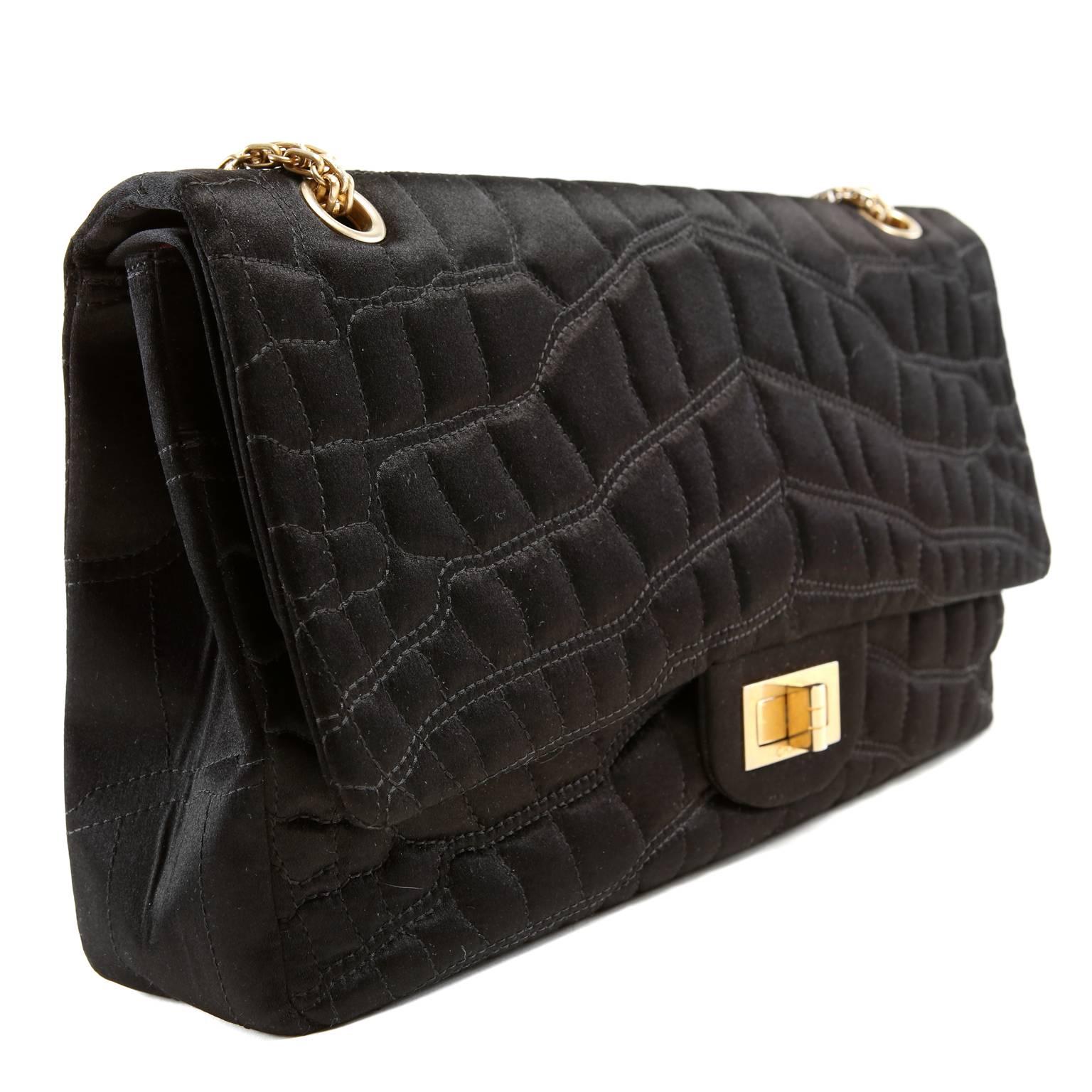  Chanel Black Satin Crocodile Print 2.55 Flap Bag is in pristine condition.  Unique texture and fabrication makes this piece irresistible for collectors. 
 
Black satin is quilted in crocodile skin pattern.  Matte gold mademoiselle twist lock