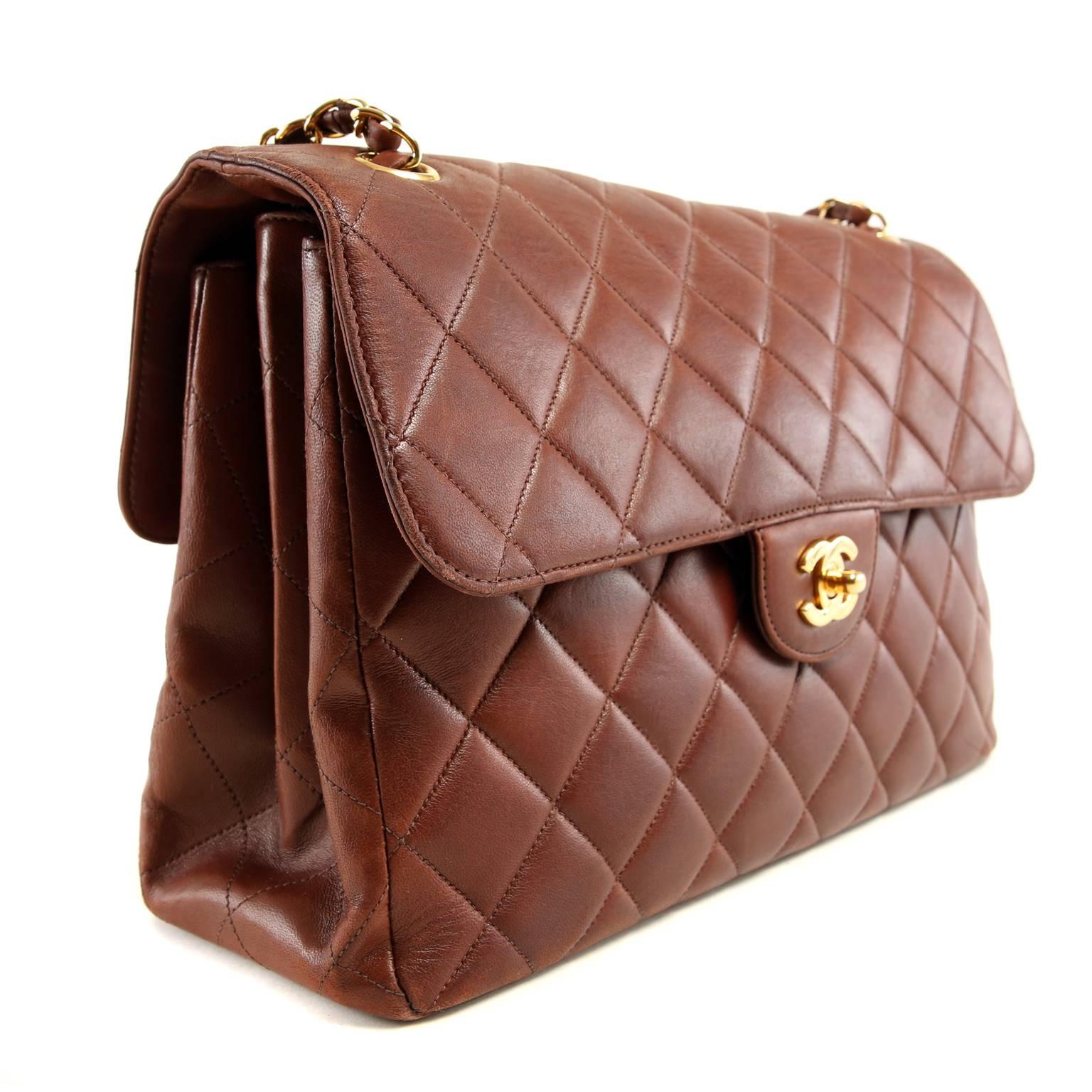 Chanel Brown Leather Double Sided Classic Flap - MINT
Spectacularly unique, this collectible piece is identical on both sides. 
 
Rich sienna brown leather is quilted in signature Chanel diamond stitched pattern.  Gold interlocking CC twist lock