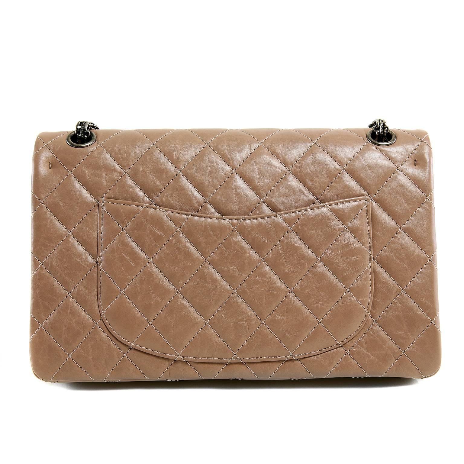 Chanel Camel Leather 2.55 Reissue Flap Bag- PRISTINE
Uniquely distressed leather and edgy Ruthenium hardware make this neutral classic an especially desirable piece. 
 
Warm caramel colored distressed leather is quilted in signature Chanel