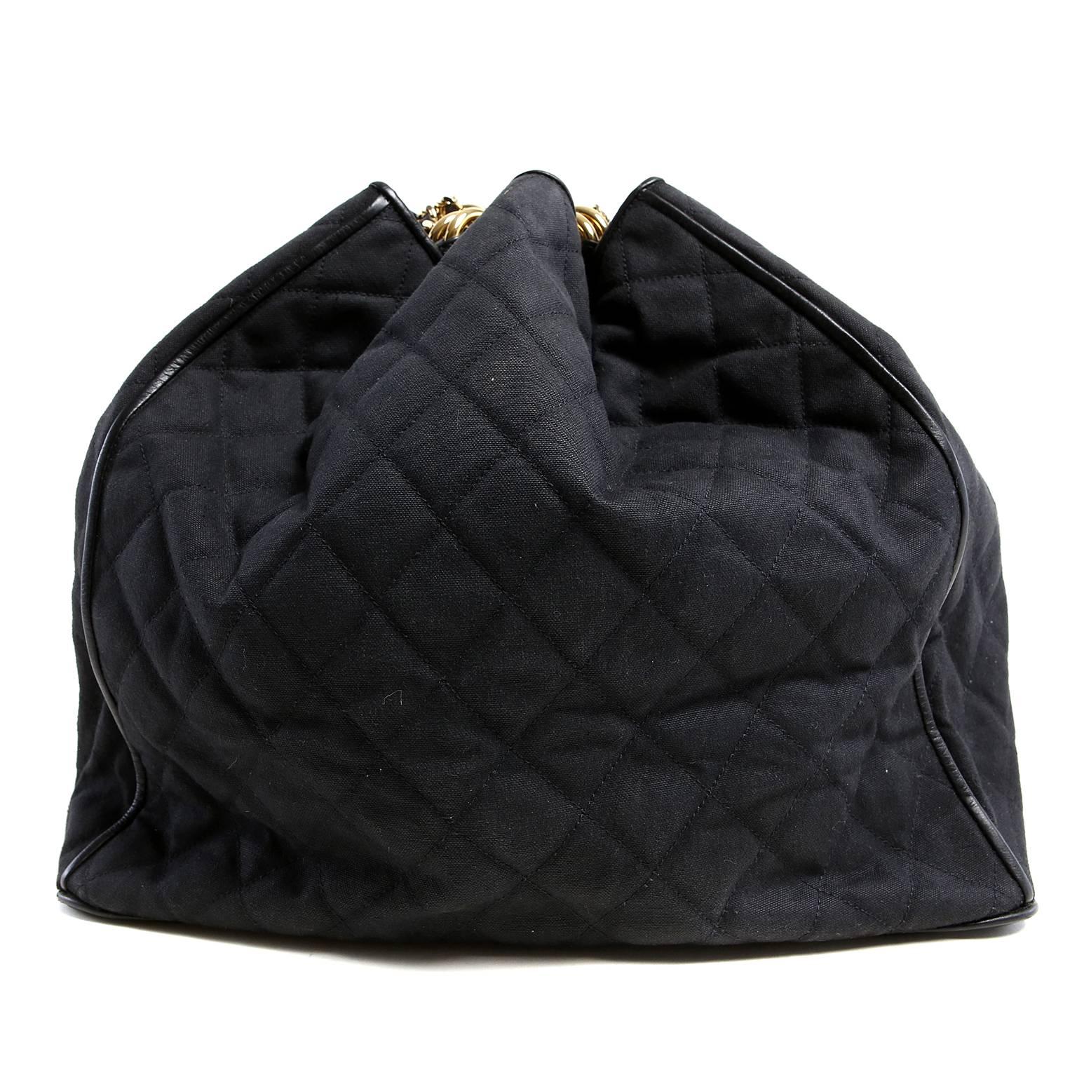 Chanel Black Quilted Canvas Drawstring Bucket Bag- EXCELLENT PLUS
The extra-long shoulder strap allows for shoulder or cross body wear.
 
 Black fabric bucket bag is quilted in signature Chanel diamond pattern.  Sturdy black leather bottom,