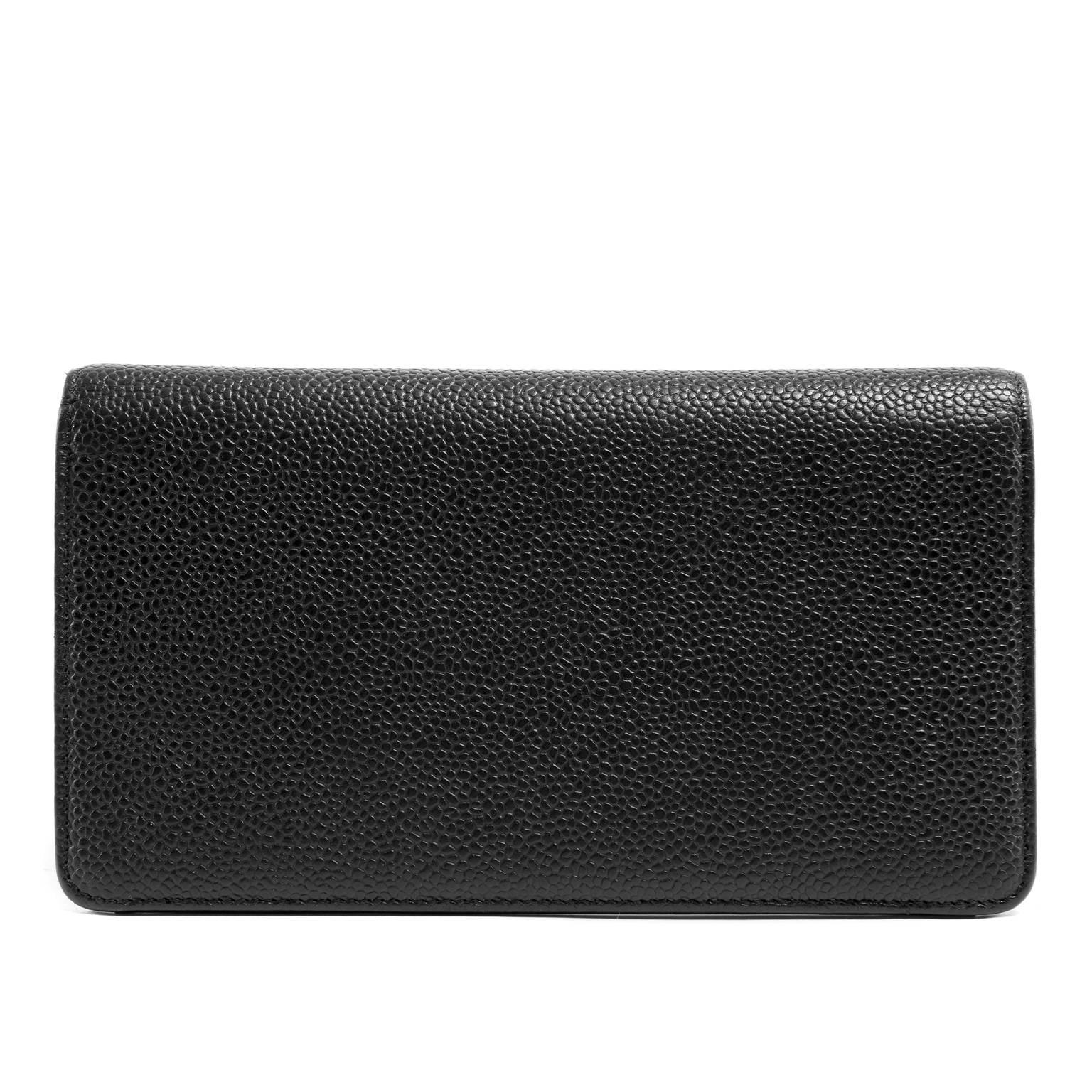 Chanel Black Caviar Leather Portfolio Wallet- PRISTINE; Never Carried
Simply elegant, this roomy wallet can be carried either men or women. 
 
Black caviar leather is textured and durable; an excellent leather for an often handles accessory. 