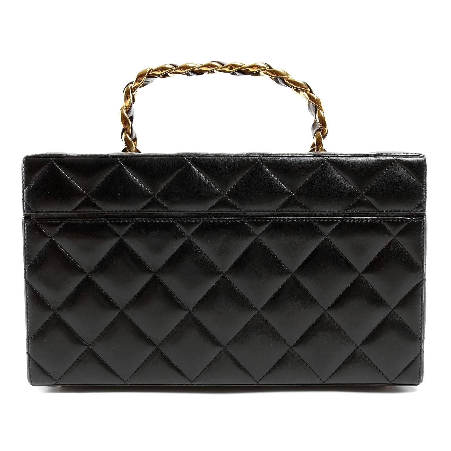 Chanel Black Leather Travel Case- PRISTINE
  A truly collectible piece, this style is rarely found in such exquisite condition.
 
Structured box case is crafted in quilted black leather.  Gold interlocking CC twist lock closure.  Burgundy leather