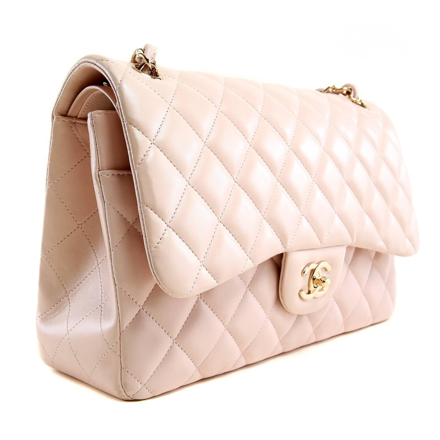 Chanel Pale Pink Lambskin Jumbo Classic- PRISTINE; appears never carried.  The delicate color is soft and feminine; a beautiful addition to any collection.
 
Ballerina pink lambskin is quilted in signature Chanel diamond stitched pattern.  Gold