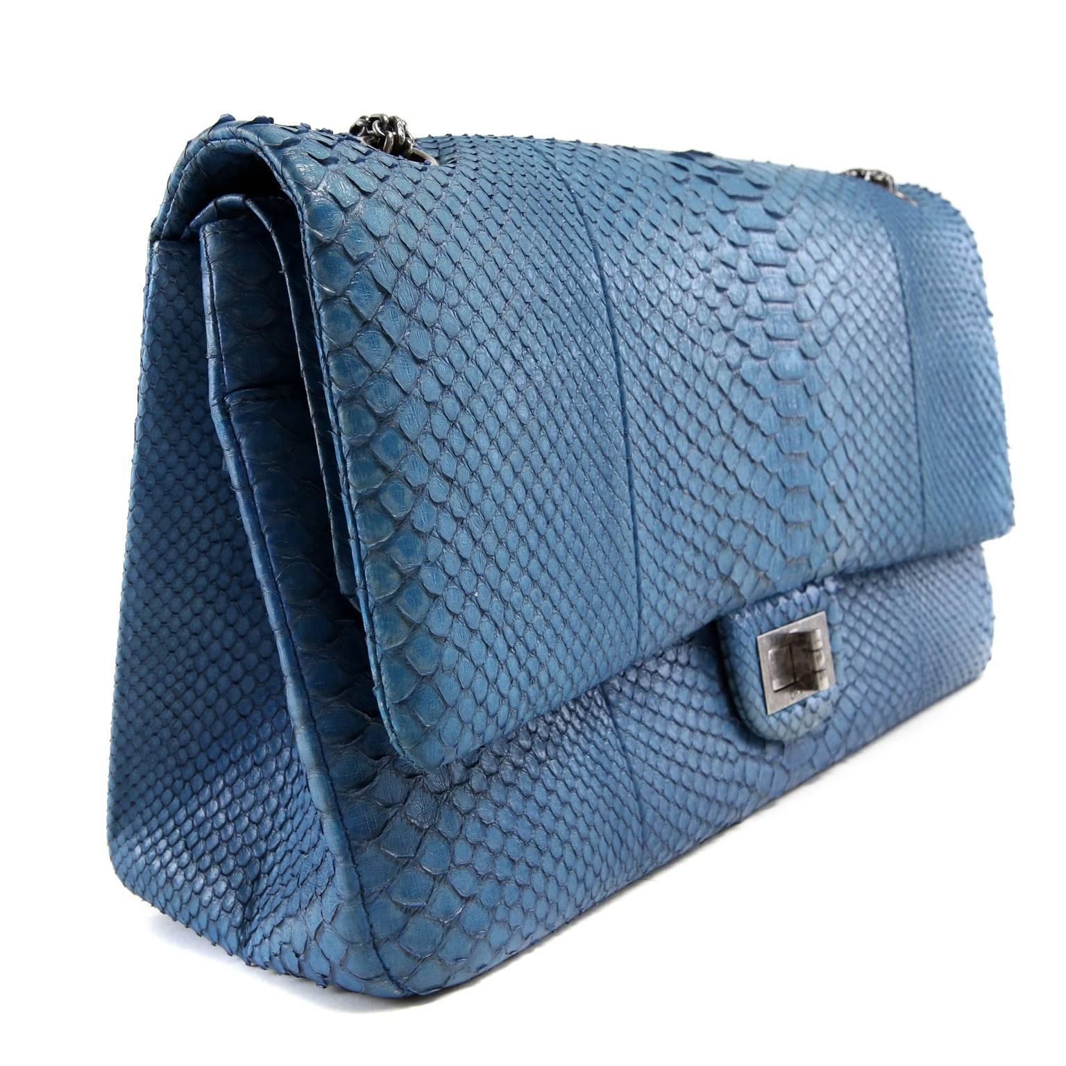 Chanel Blue Python Reissue Double Flap- PRISTINE
  The stunning exotic skin is highlighted perfectly with ruthenium hardware.  This is a must have piece for any collection. 
 
Glorious blue python has grey striations and outlines each scale