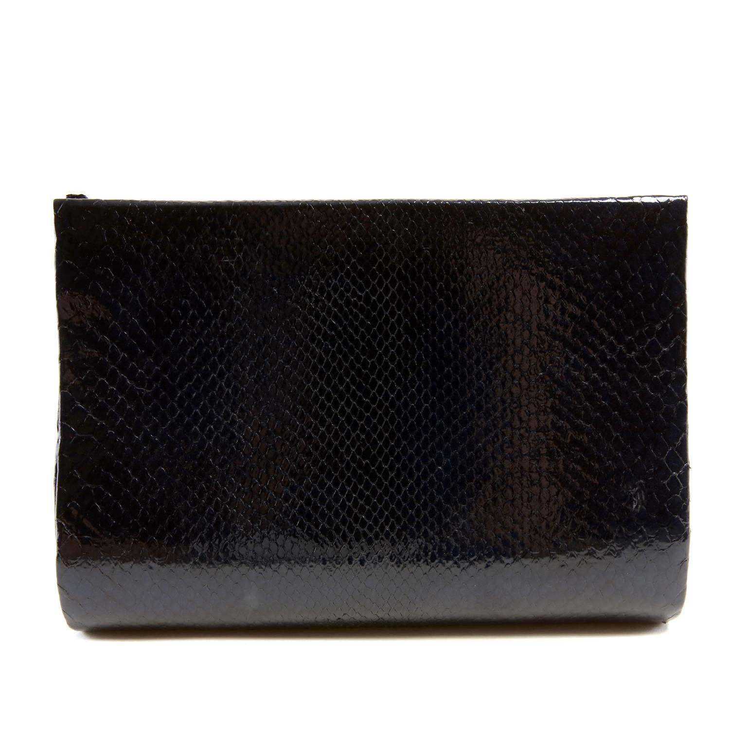 Paige Gamble Black Python Clutch- PRISTINE
  Totally unique and very rare, this eye-catching collectible combines brilliant color and textures.
 
Slim black glazed python clutch is adorned with multihued and iridescent agate slices.  Magnetic