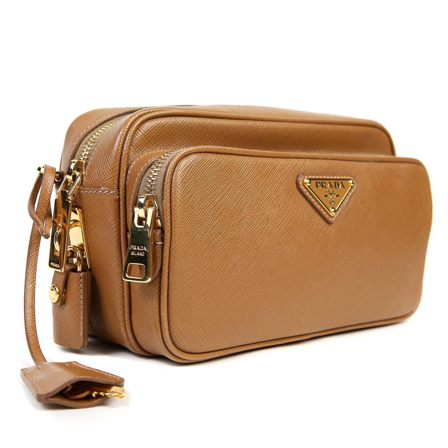 Prada Camel Leather Double Zip Crossbody Bag - Near Pristine
 A fantastic find, this deceptively petite piece carries quite a bit and has the advantage of being hands free. 

Durable and textured Camel lux Saffiano leather with gold tone hardware