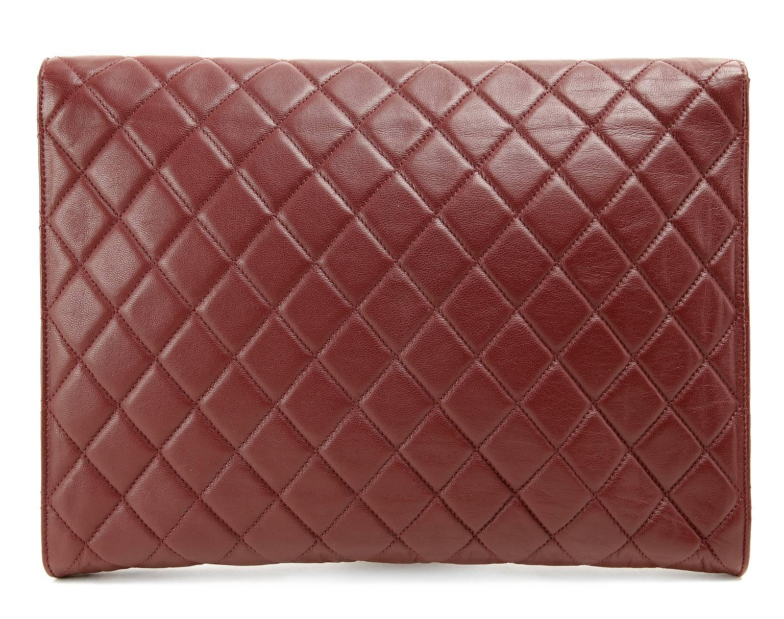 Chanel Bordeaux Leather Oversized Clutch- Pristine;  appears never carried
 A gloriously chic document holder or a strikingly beautiful clutch, this Chanel is a versatile addition to any collection.
 
Bordeaux wine leather oversized clutch is