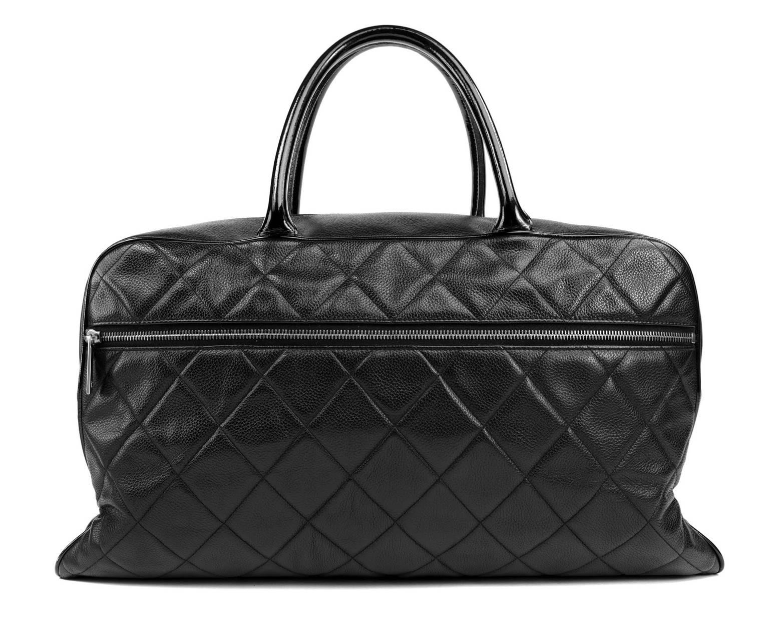 Chanel Black  Leather XXL Weekender - PRISTINE
  Perfect for air travel or a quick overnight getaway, this roomy Chanel is unisex, practical and chic.
 
Durable black textured leather is quilted in signature Chanel diamond stitched pattern. 