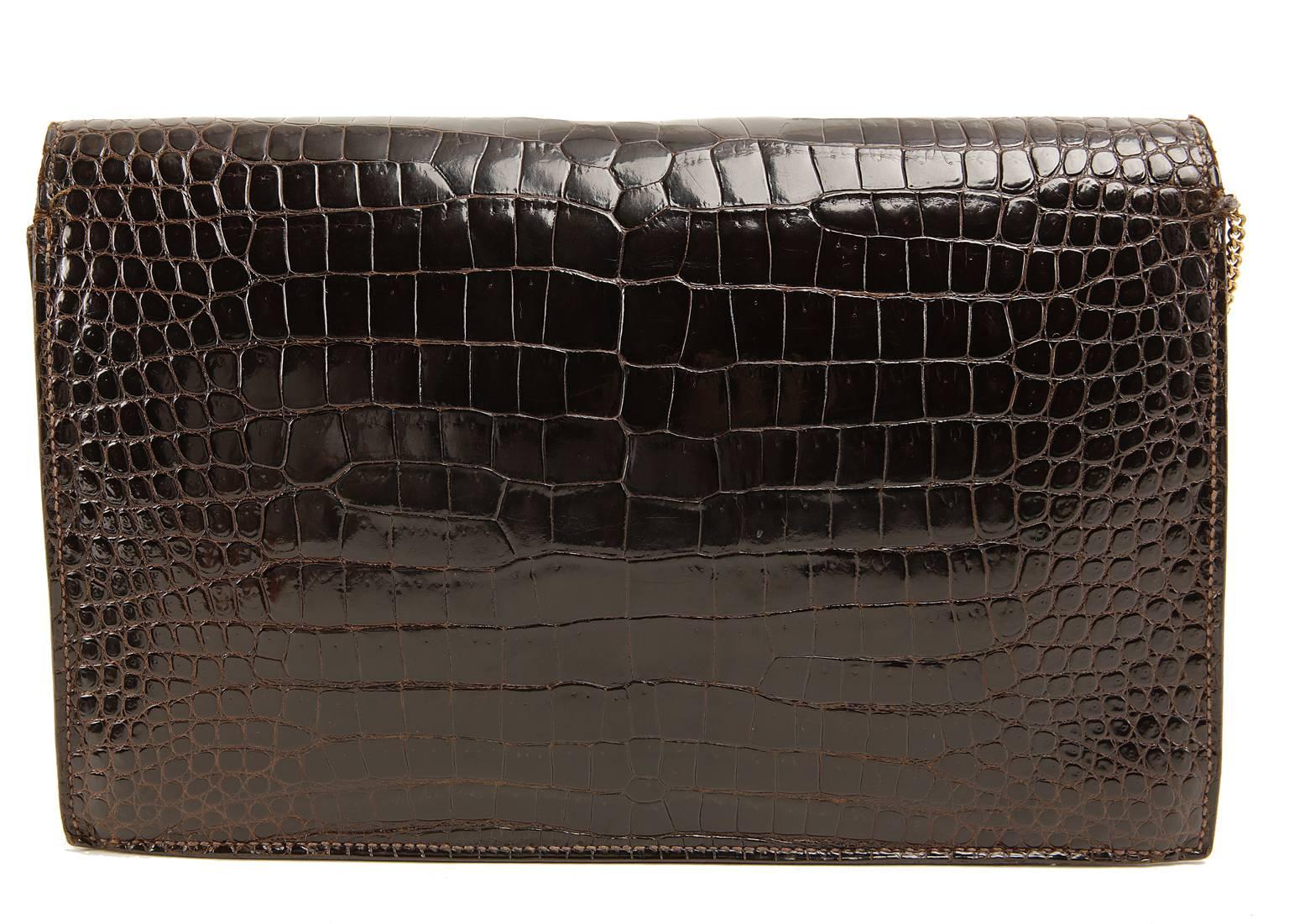 Hermès Brown Porosus Crocodile Lydie is in beautiful condition. Highly collectible, the Lydie is no longer in production.   It may be carried on the shoulder or as a clutch. 
 
Porosus Crocodile is considered by many to be the premier Hermès