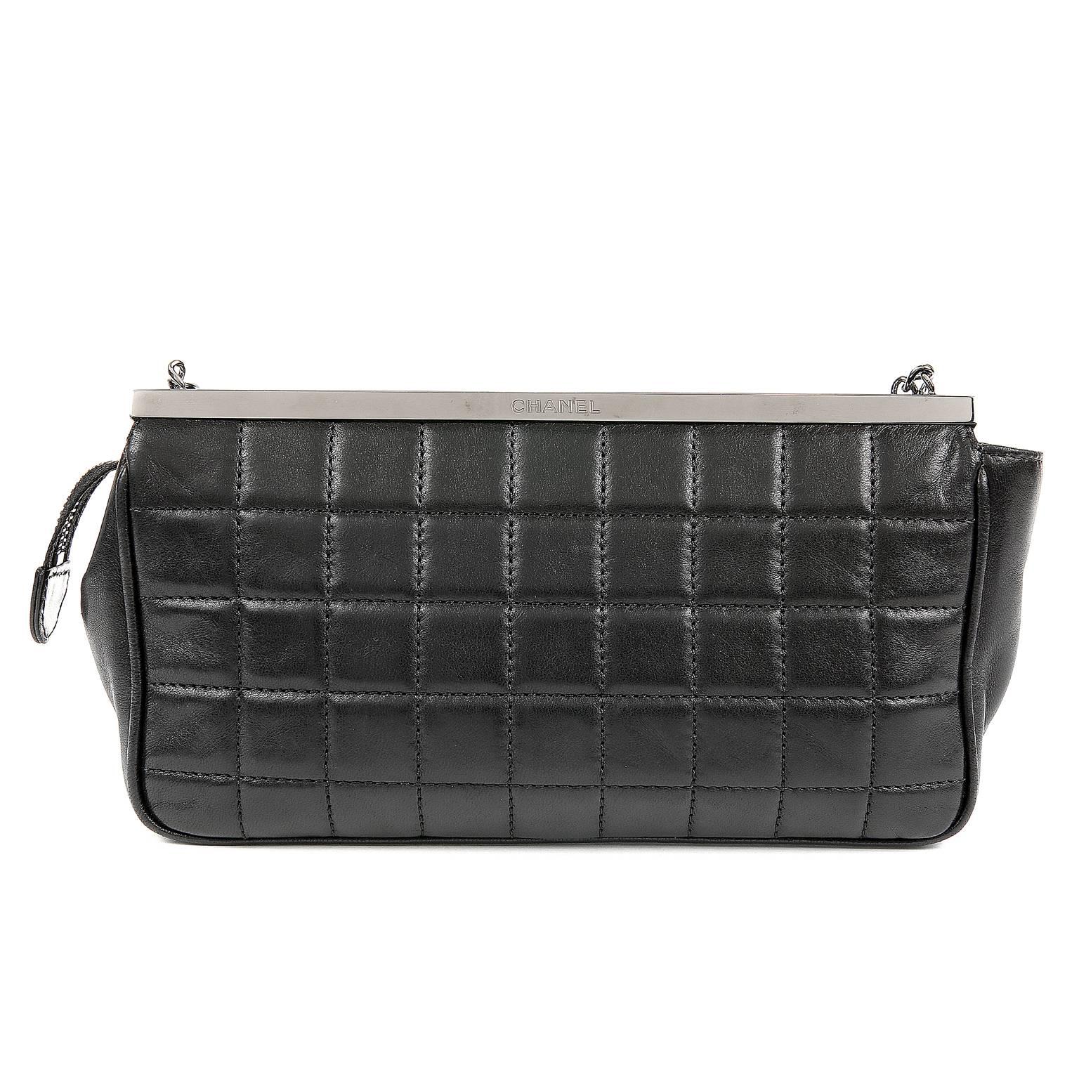 Chanel Black Lambskin Dripping Chains Evening Bag- MINT 
 Highly collectible piece; RARE

Black lambskin is quilted in square quilt pattern.  Framed top with secure zipper access.  Silver chains of varying lengths and link style literally drip from