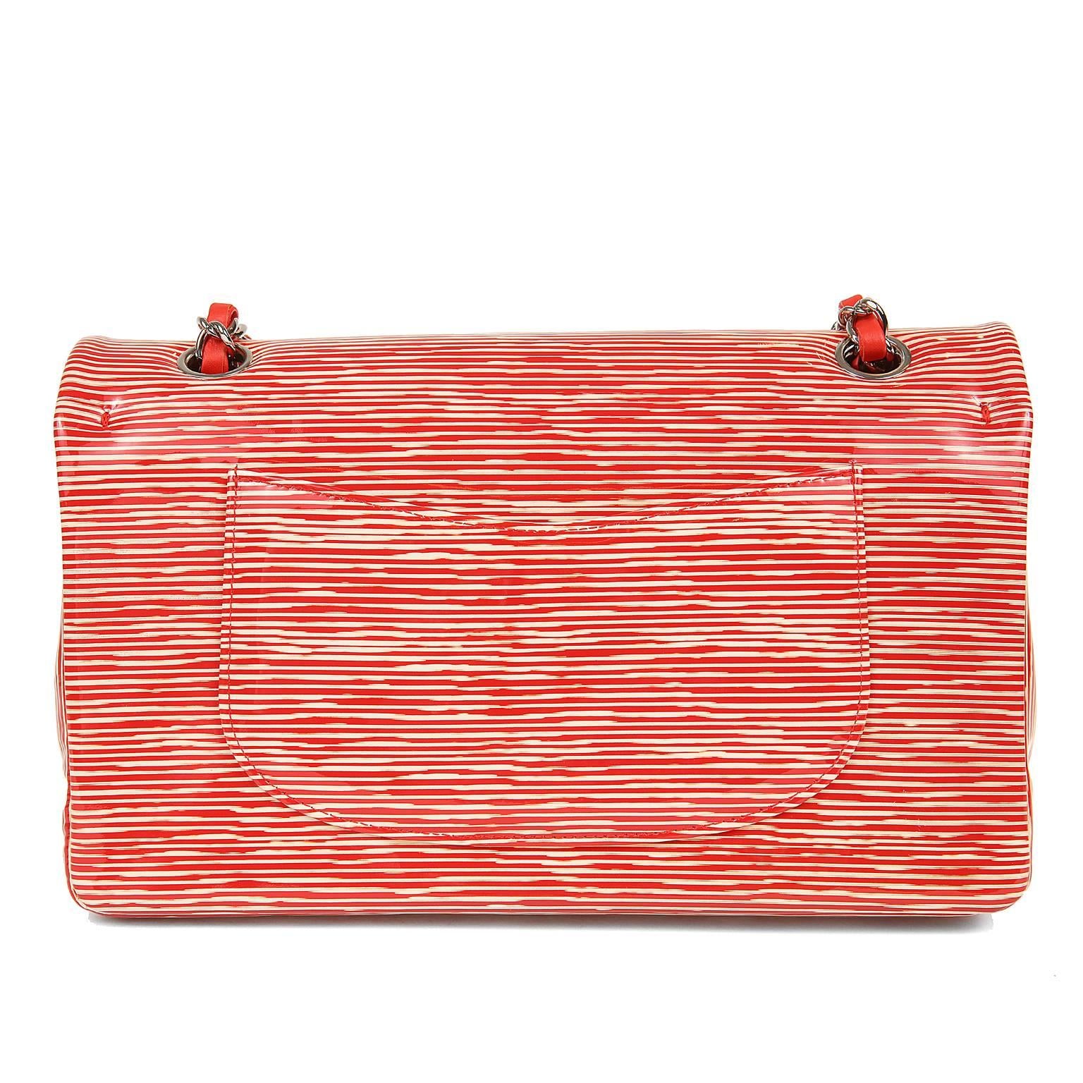 Chanel Red and Cream Striped Patent Leather Classic Flap- PRISTINE carried. 

Medium Double Flap Classic in cherry red patent leather with ivory stripes.    Silver interlocking CC twist lock secures the exterior flap.  Bright red leather interior