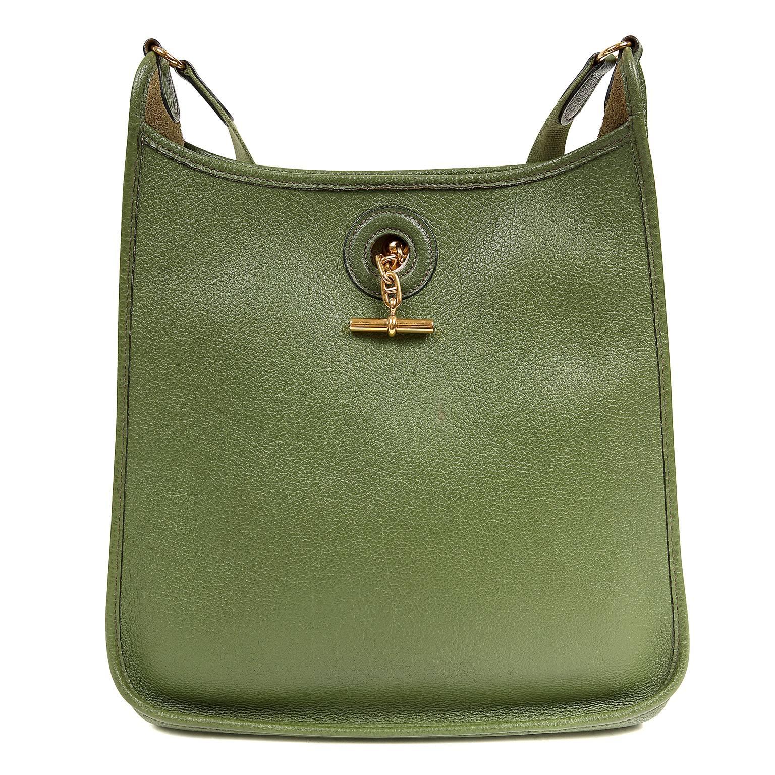 Hermès Bengal Green Togo Vespa Bag is in excellent condition.  Before the Evelyne, the Vespa was the everyday cross body of choice. This neutral green Togo version is a fantastic find.

 Togo is a scratch resistant calf leather with a wonderful