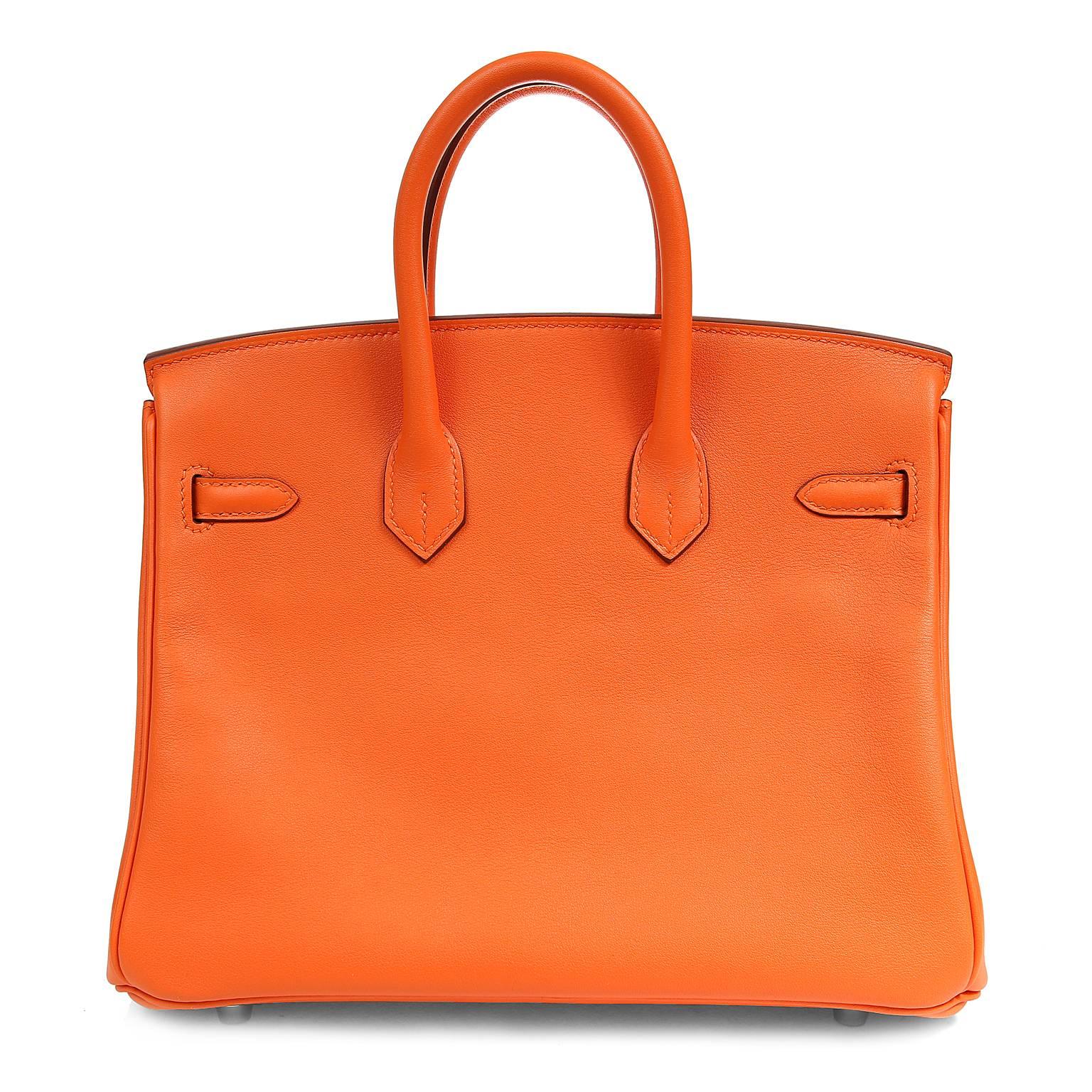  Hermès 25 cm Feu Birkin Bag in Swift leather with Gold hardware- Pristine unworn condition with plastic intact on all hardware.

Waitlists exceeding a year are commonplace for the intensely coveted Birkin bag.  Each piece is hand sewn by skilled