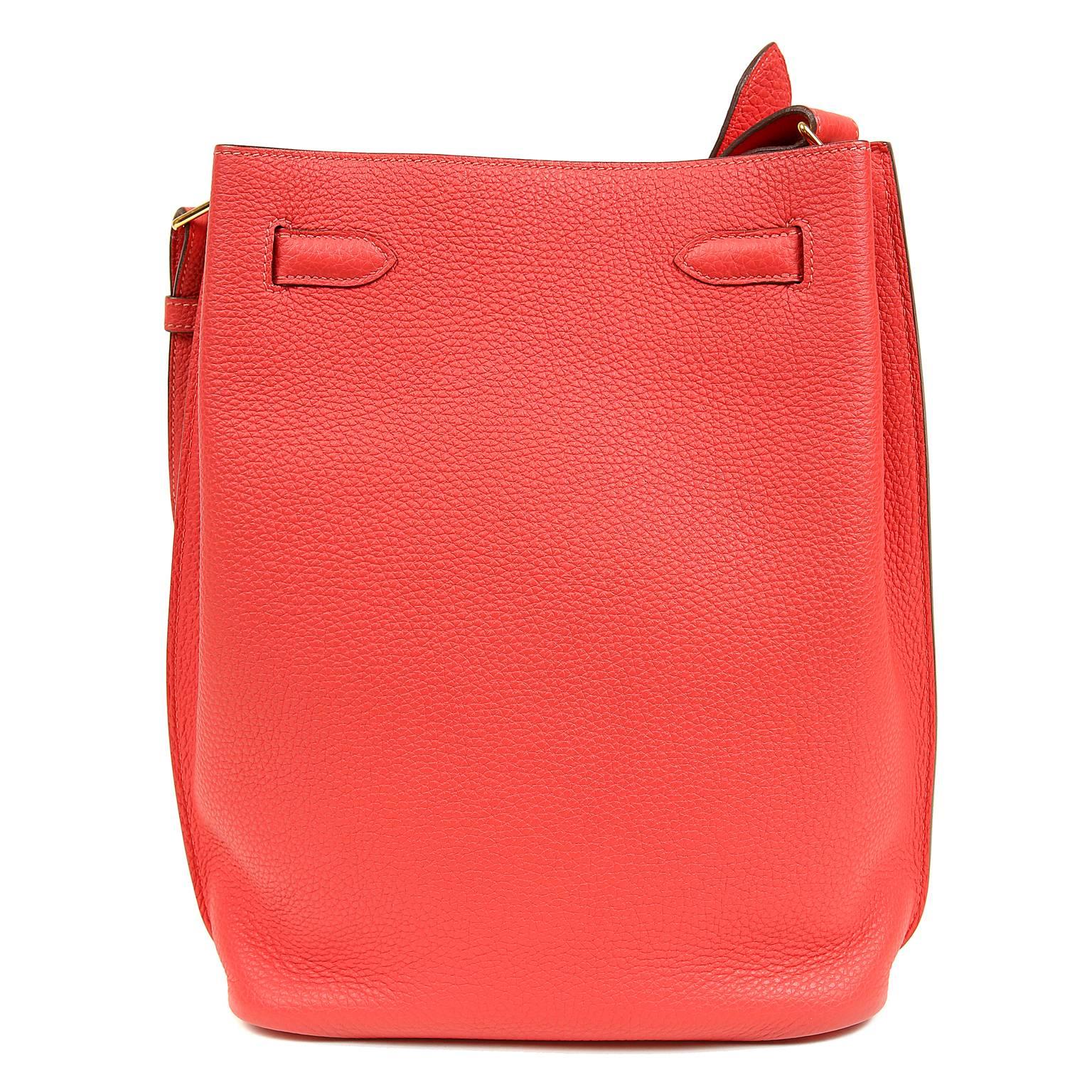 Hermès Geranium 26 cm So Kelly Bag- PRISTINE
Never carried, the protective plastic is intact on the hardware.   Introduced in 2008, the So Kelly is a relaxed shoulder carried version of the traditional Kelly. 

Vivid Geranium Togo calf leather is
