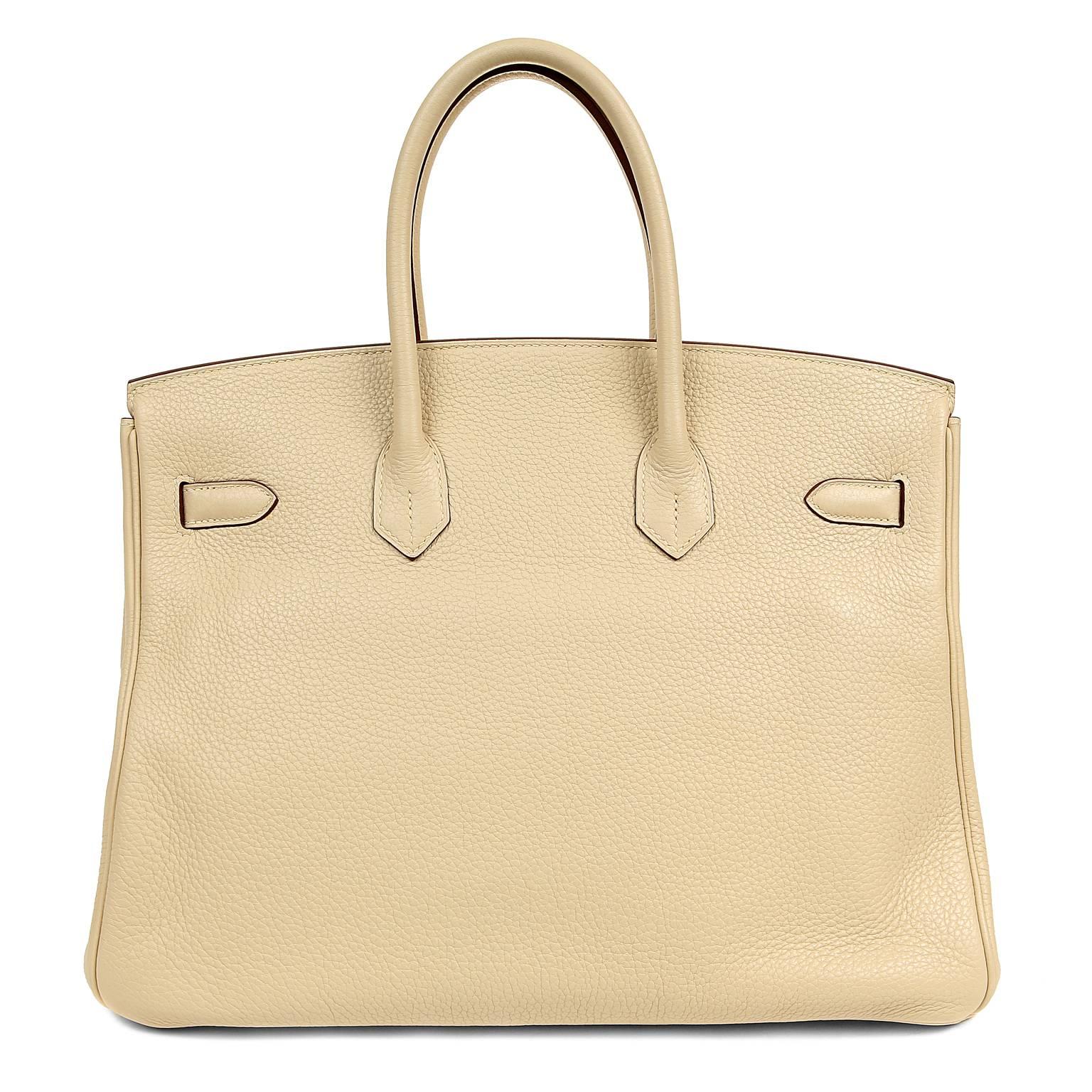 Hermès Parchemin Togo 35 cm Birkin Bag- PRISTINE; appears never carried. 
Waitlists exceeding a year are commonplace for the intensely coveted Birkin.  Each piece is hand sewn by skilled artisans and represents the epitome of fashion luxury. 