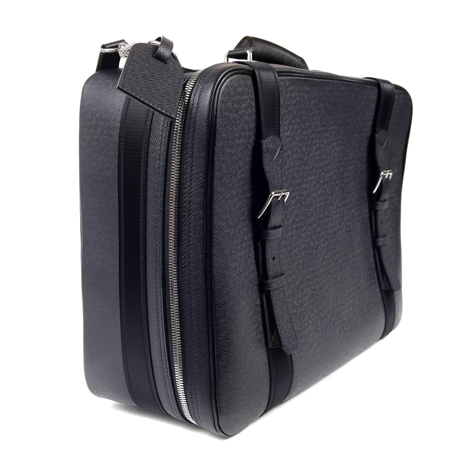 Louis Vuitton Navy Taiga Leather Belted Luggage- NEW
 Perfect for quick getaways or as a carry on, this piece is a great find. 

Dark navy blue Taiga leather is textured and extremely durable.  Silver tone protective footed bottom and two-way zip