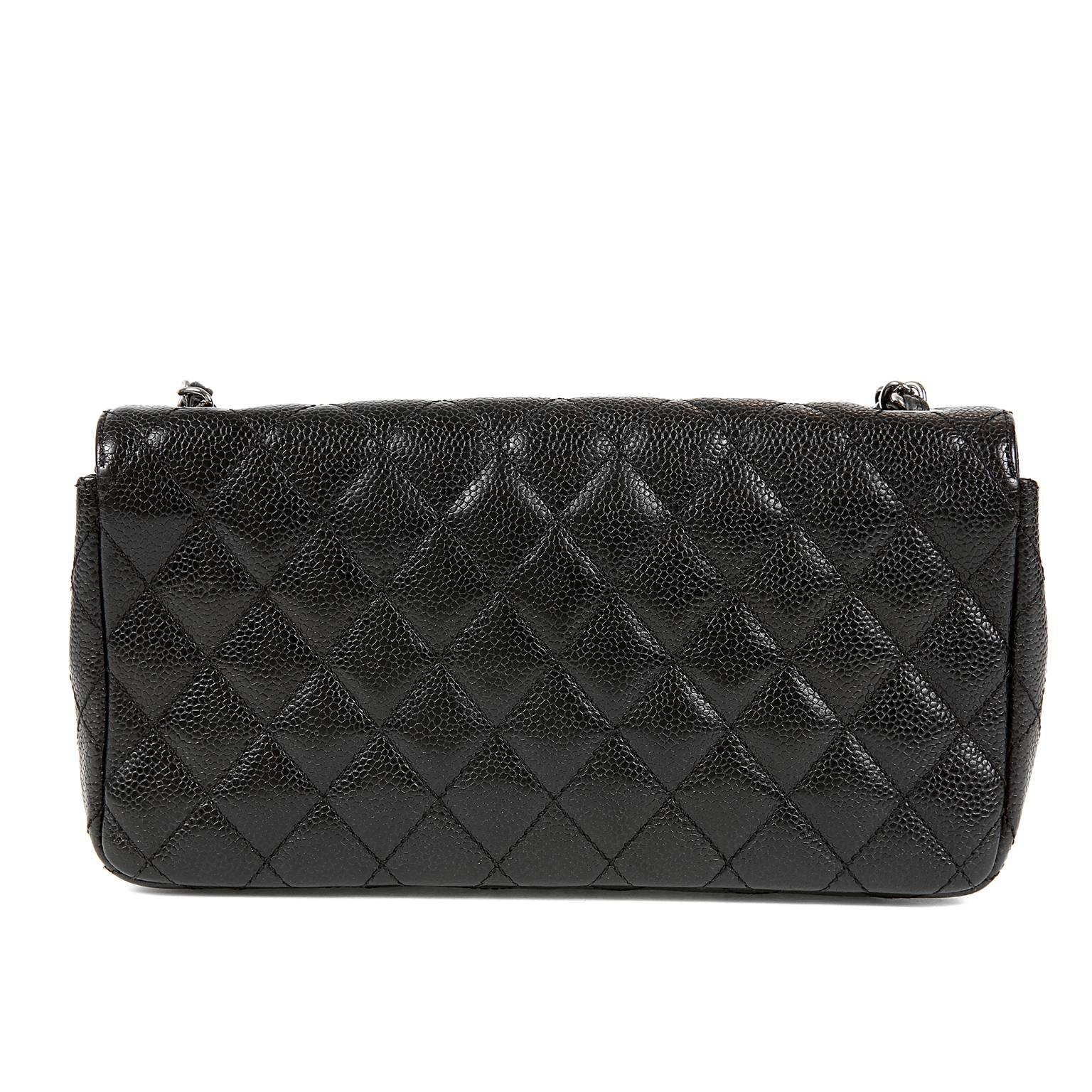 Chanel Black Caviar East West Classic Flap Bag- Nearly Pristine
  Perfectly scaled for easy day to evening transitions, this Chanel is a smart buy.

Black caviar leather is textured and durable.  Quilted in signature Chanel diamond stitched pattern.