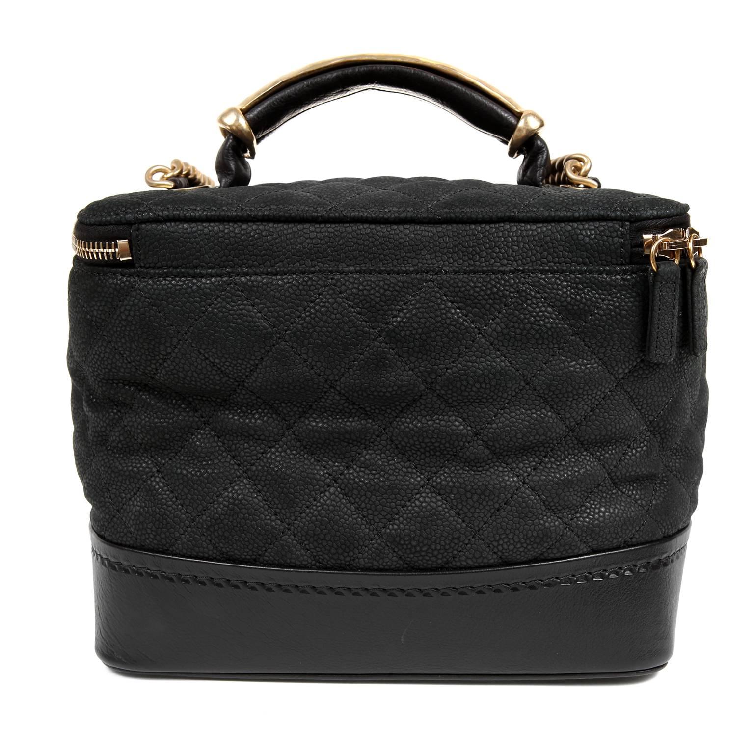Chanel Black Leather Globetrotter Bag- PRISTINE
  The unique take on a cosmetic travel bag is both stylish and practical.

Textured matte black caviar leather structured bag is quilted in signature Chanel diamond pattern.  Smooth leather surrounds