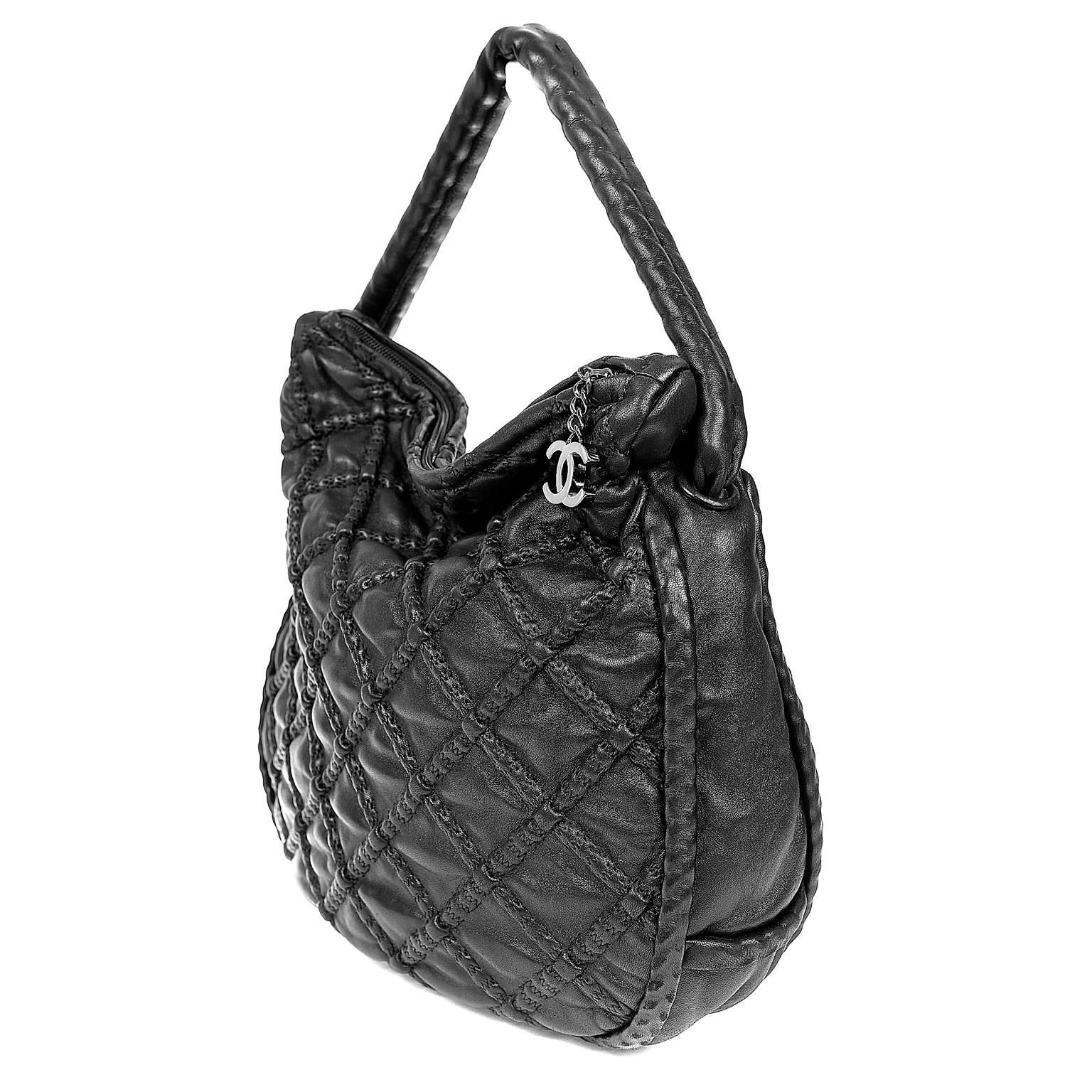 Chanel Black Leather Hidden Chain Hobo- PRISTINE
  Perfect for every day enjoyment, the unique texture adds interest to the back façade. 

Black leather hobo has signature Chanel diamond pattern welting.  Zippered top with silver interlocking CC