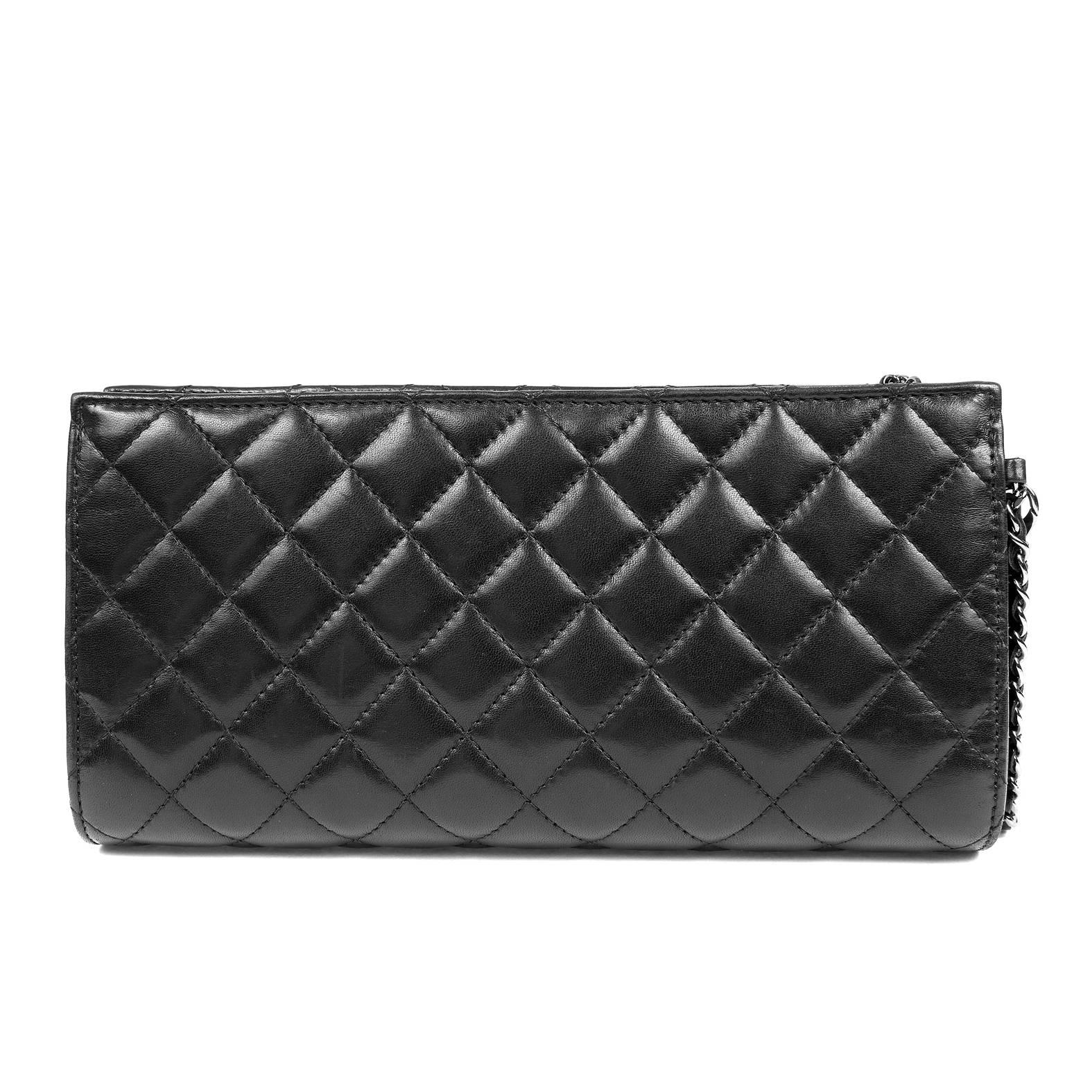 Chanel Black Lambskin Wristlet- PRISTINE
 Carried as a clutch or tossed inside a larger tote, this piece is both chic and versatile. 

Soft black lambskin pouch is quilted in signature Chanel diamond stitched pattern. Front snap closure pocket   and