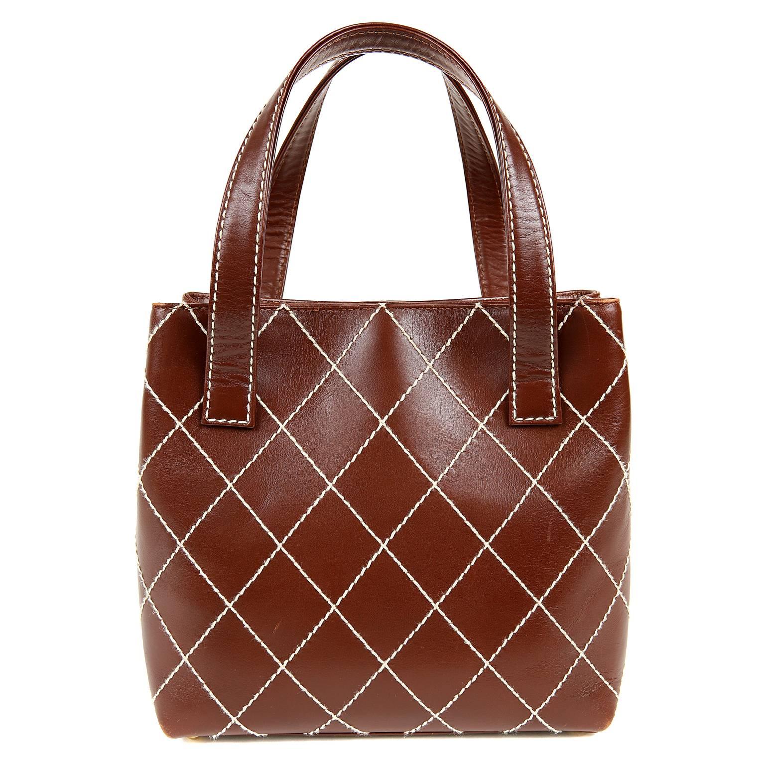 Chanel Brown Topstitched Day Bag- EXCELLENT
  Richly colored with contrasting stitching, it elevates an everyday bag to something special.

Russet brown leather is topstitched in signature Chanel diamond pattern with contrasting ivory thread. 