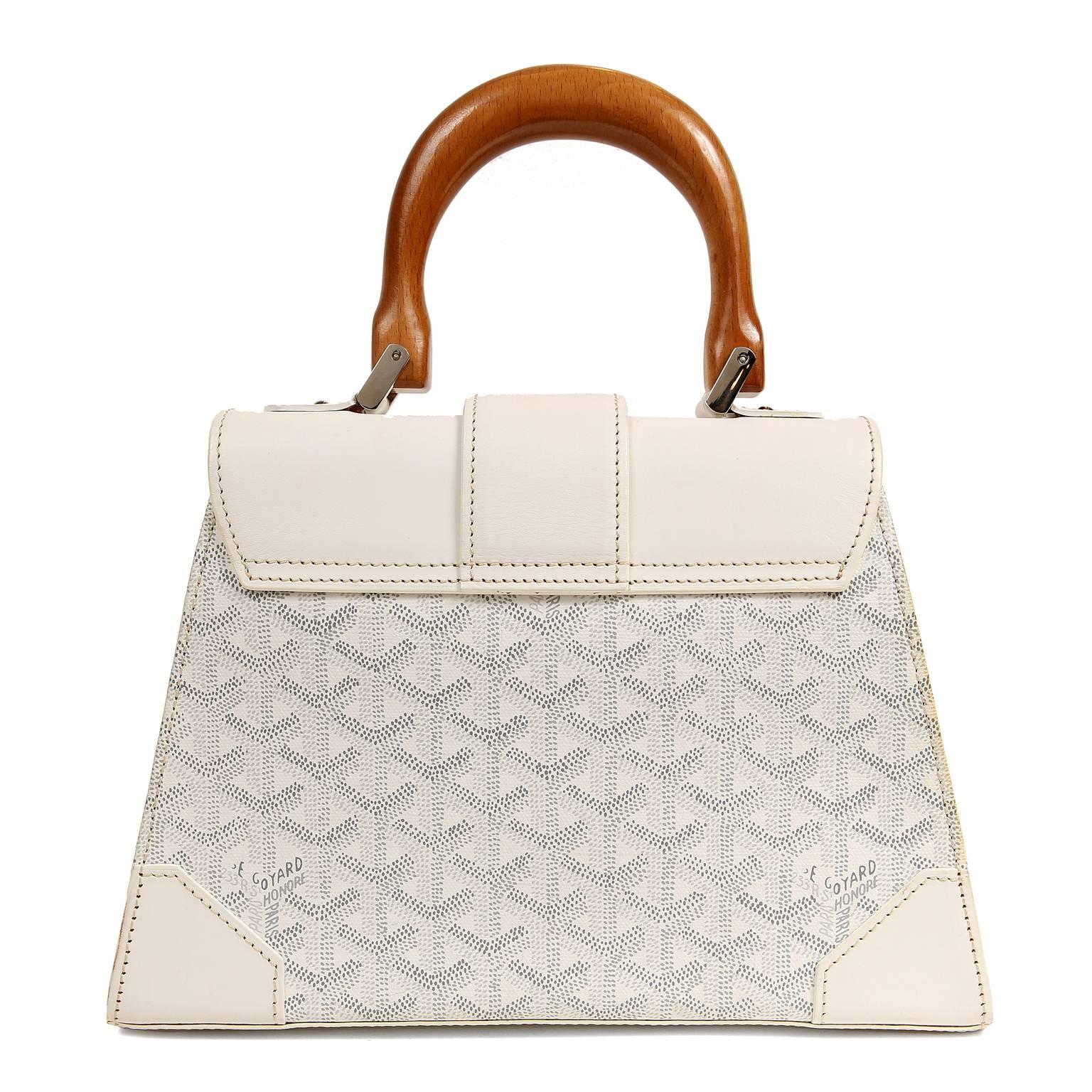 Goyard White Saigon Handle Bag- Pristine, perhaps carried once
Structured top handle bag in signature Goyard chevron monogram canvas.  Sturdy reinforced white leather sides, flap and bottom.  Exquisite wooden accents and top handle.  Silver tone