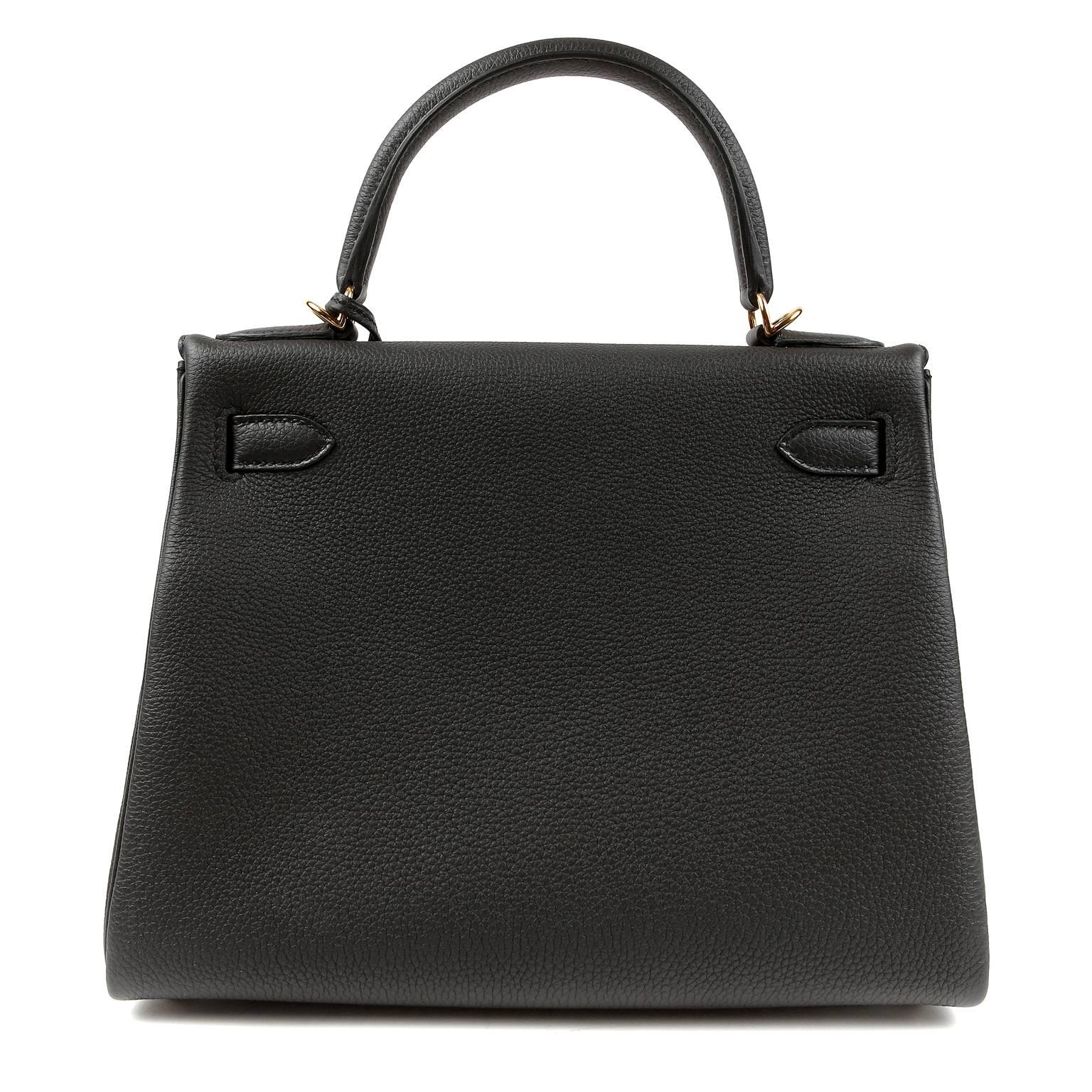  Hermès Black Togo 28 cm Kelly- PRISTINE;  The protective plastic remains intact on the hardware.   Hermès bags are considered the ultimate luxury item worldwide.  Each piece is handcrafted with waitlists that can exceed a year or more.  The