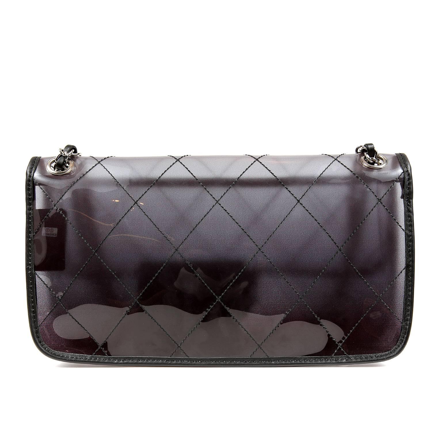 Chanel Naked Flap Bag- PRISTINE
  A sporty runway style, the Naked Flap Bag is a must have for collectors. 

Smoked PVC flap bag is stitched in signature Chanel diamond pattern. Black leather trimmings and silver hardware accents.  Interlocking CC