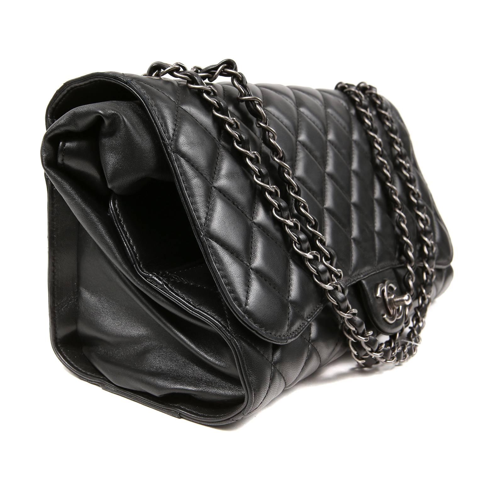 Chanel Classic Supermarket Drawstring Shopping Bag- PRISTINE
  From the 2014 Fall Winter Collection, this edgy Classic Flap converts to a drawstring tote- two bags in one. 

Black lambskin is quilted in signature Chanel diamond stitched pattern.