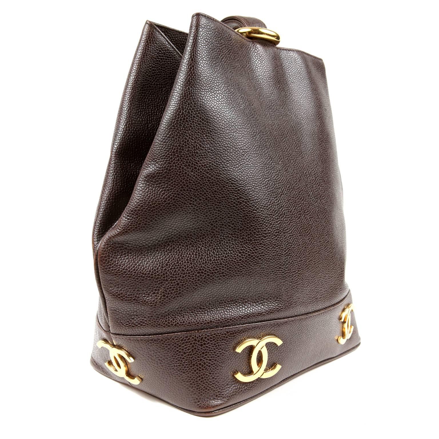 Chanel Brown Caviar Leather Sling Bag- Excellent Plus Condition
  The sporty vintage style is right on track with the current bucket bag craze. 

Structured bucket style bag is designed in durable brown caviar leather.  Gold tone interlocking CC