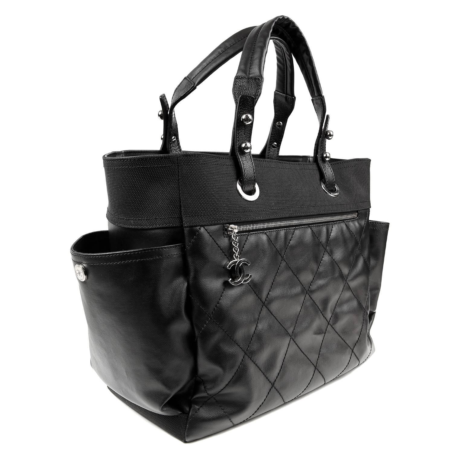 Chanel Black Coated Canvas Biarritz XL Tote- MINT Condition
  Sturdy and durable, it is a great unisex piece with multiple uses.

Weather friendly coated canvas is stitched in signature Chanel diamond pattern.  Front pocket has silver interlocking