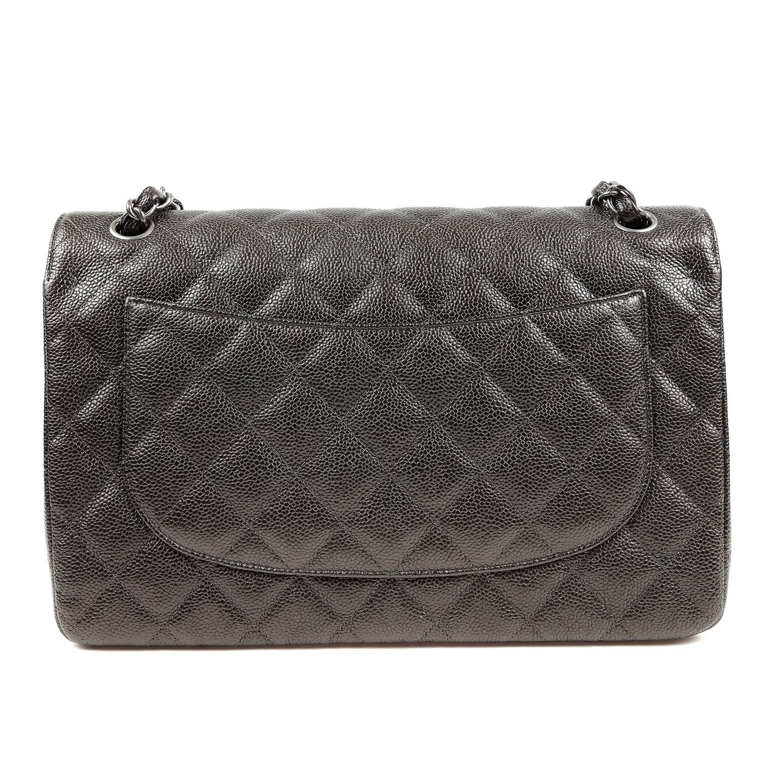 Chanel Graphite Caviar Jumbo Double Flap Classic- PRISTINE
  It is particularly stunning in this rare graphite coloration with ruthenium hardware accents.

Edgy Graphite caviar leather is textured and durable.  Quilted in signature Chanel diamond