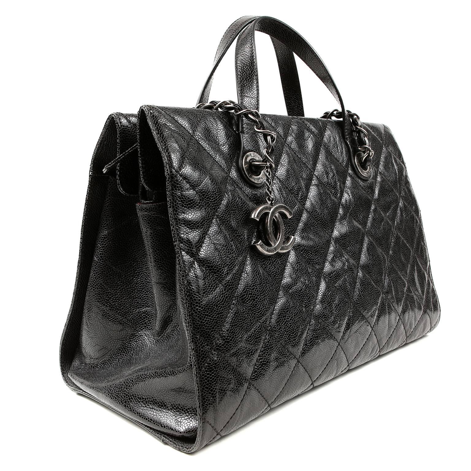 Chanel Black Distressed Caviar Day Bag- Pristine Condition
  Carried as a briefcase or a handbag, this versatile piece offers many options for year-round enjoyment.  

Black glazed caviar leather has a distressed finish and is quilted in signature