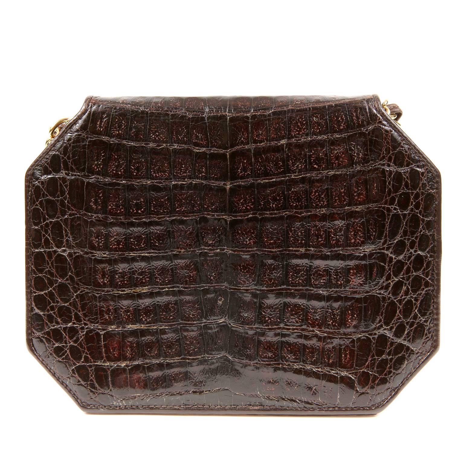 Chanel Espresso Crocodile Octagonal Bag- Excellent
  A rare vintage style, it is a beautiful addition to any collection. 

Deep espresso brown crocodile skin is structured in an octagonal shape.  Gold interlocking CC twist lock secures the front