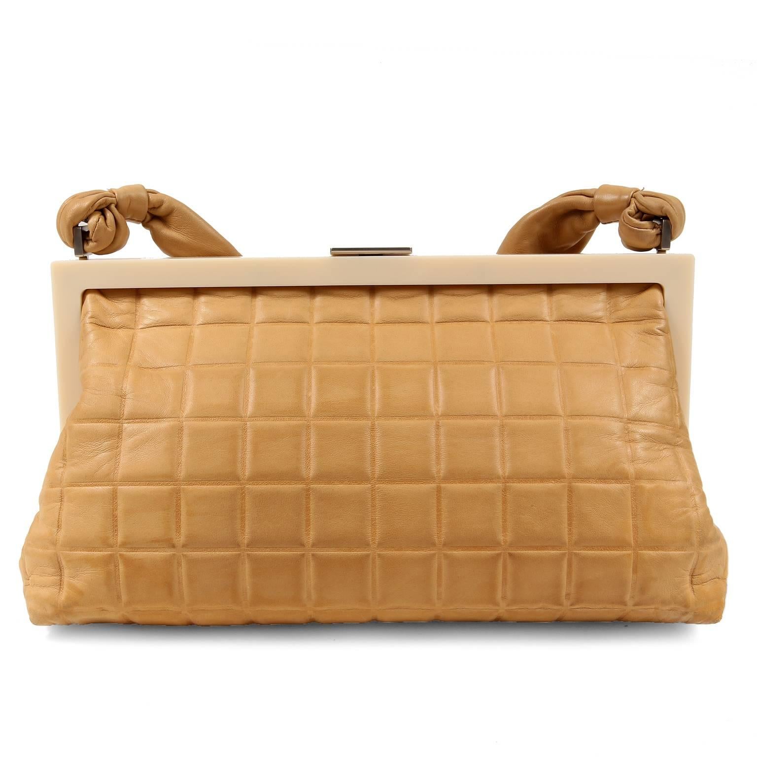 Chanel Beige Chocolate Bar Framed Bag- EXCELLENT PLUS 
 Perfect for dinner or traveling light, this neutral piece is certain to become a favorite. 

Beige leather is square quilted with an ivory resin framed top. Brushed silver CC clasp and beige