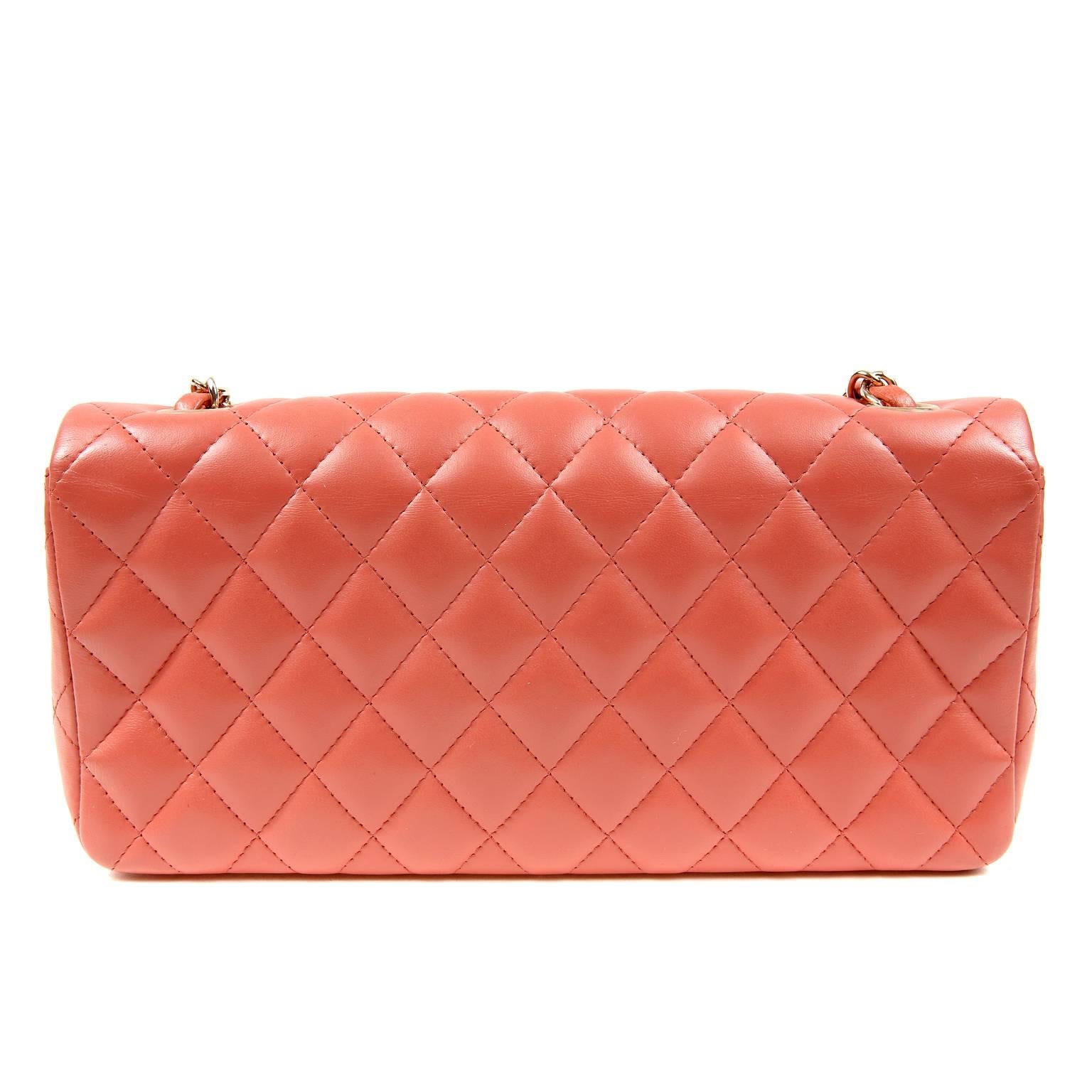 Chanel Salmon Lambskin East West Flap Bag- PRISTINE
 The captivating color and medium silhouette makes this Chanel a great addition to any collection. 

Corally salmon lambskin is quilted in signature Chanel diamond pattern.  Gold interlocking CC