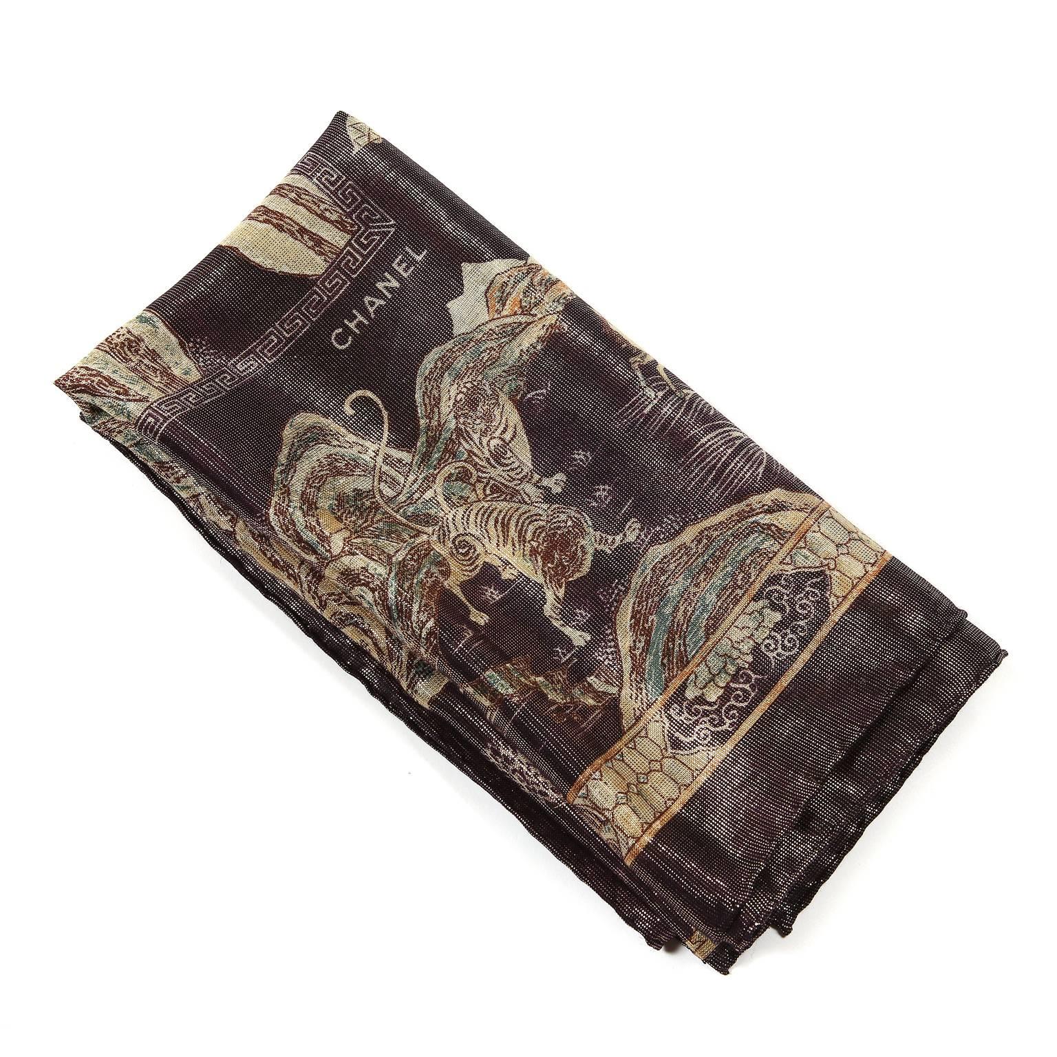 Chanel Black Oriental Gold Threads Shawl- EXCELLENT
  Black background is interspersed with glittering gold threads. Traditional Asian scenery covers the landscape: wild animals, people, ocean scenes, architecture. 