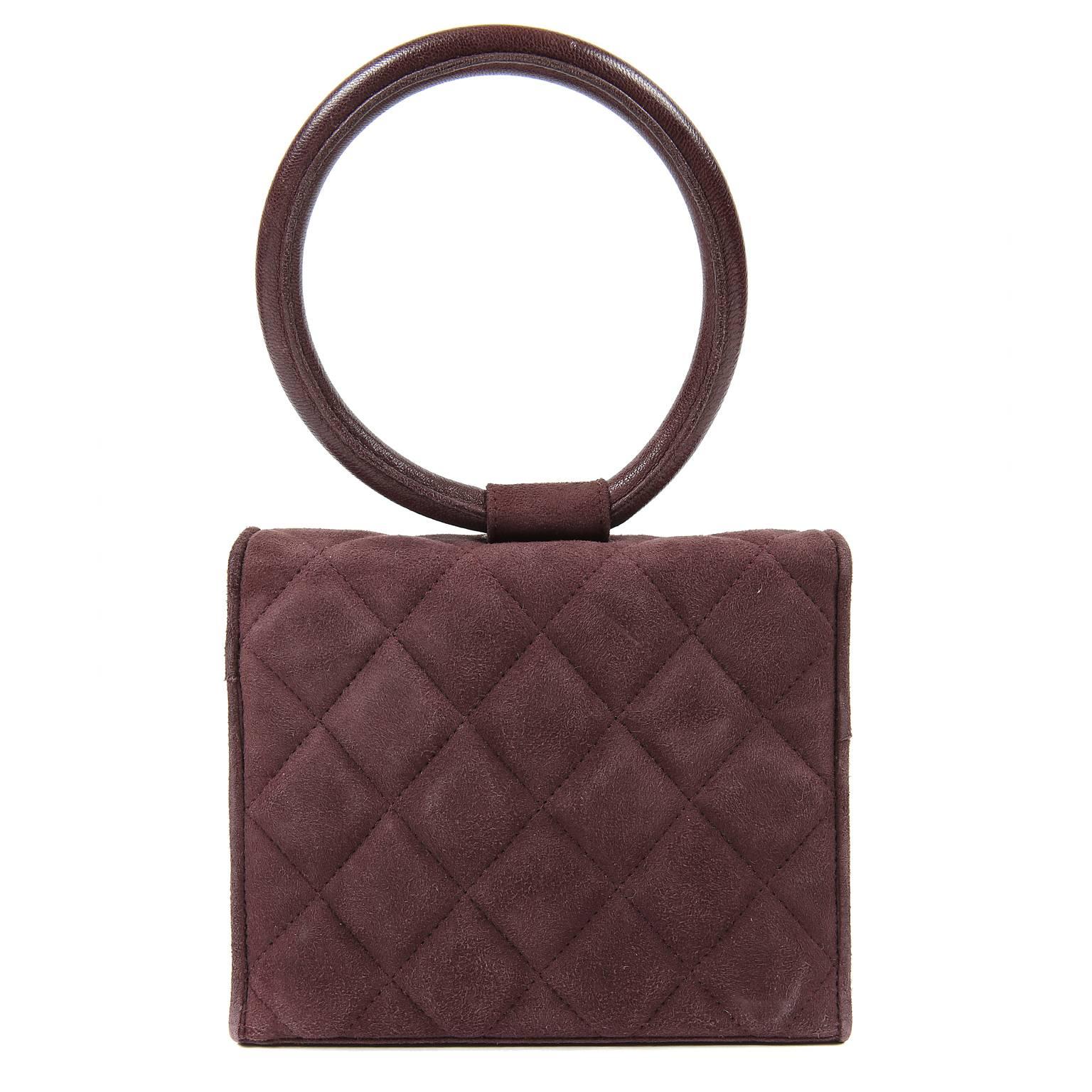 Chanel Wine Suede Gripoix Jewels Evening Bag- MINT
  A very rare piece featuring an iconic Chanel Gripoix flower design that is a must have for any collector. 

Deep wine suede is quilted in signature Chanel diamond pattern.  Front flap is adorned