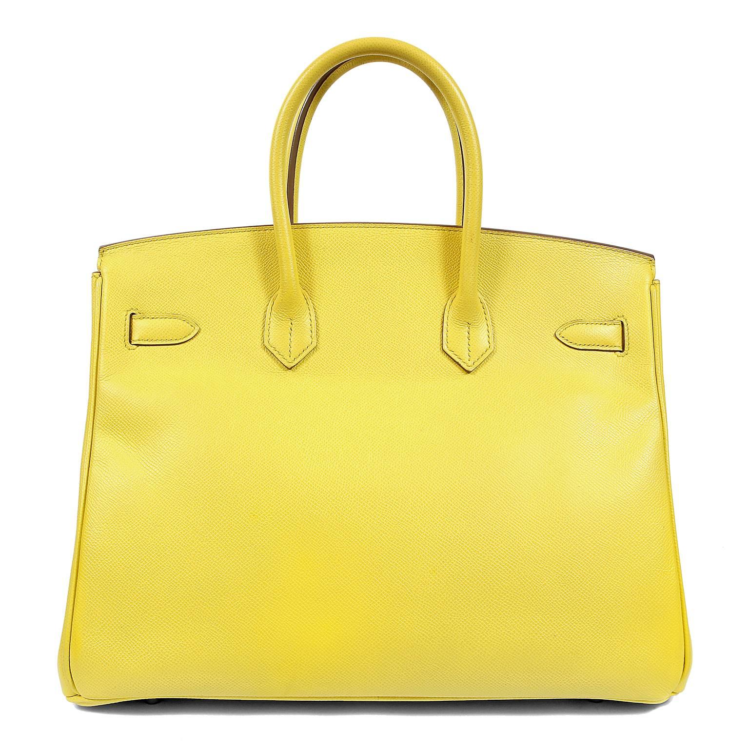 This authentic Hermès Soufre Epsom 35 cm Birkin is in pristine condition.    Considered the ultimate luxury item, the Hermès Birkin is stitched by hand. Waitlists are commonplace.   Soufre (“sulfur” in English) is a bright yellow pop of color that